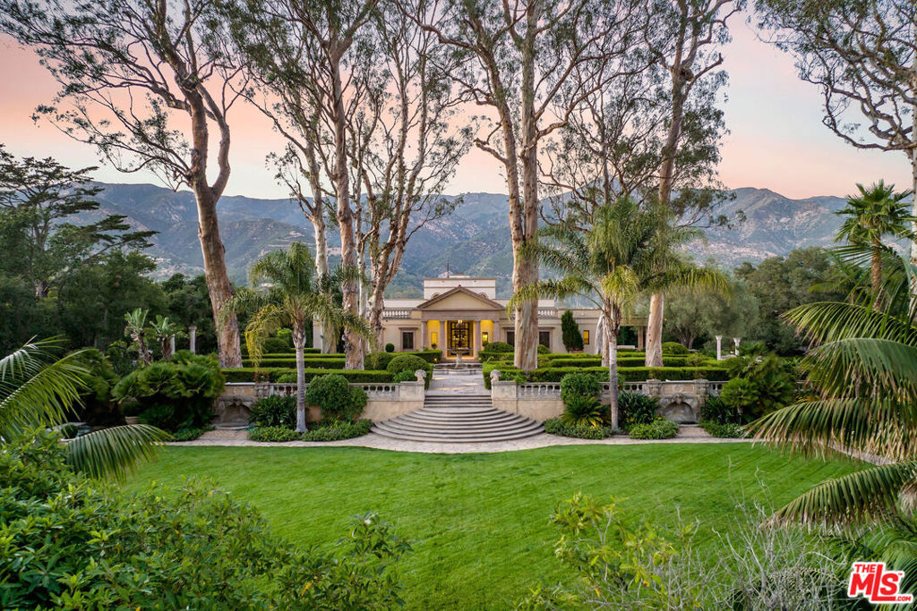 The epitome of grace and grandeur, the ultra-private neoclassical estate presides over 4 acres of mountain views, mature eucalyptus, and 200-year-old oaks. Once host to a breathtaking music pavilion while part of the original Arcady Estate, the approx. 7,775 Sq.ft. main house was extensively renovated by acclaimed Warner Group Architects to combine Palladian details with modern design. 4 bedrooms in total, the ground floor is an entertainer's paradise with the airy great room opening up to terraced gardens galore. Symmetry, style, and a natural flow from the residence to the gardens embody Montecito's standard of elevated outdoor living. This masterful garden property (featured in Veranda Magazine & Architecture Digest) also enjoys a guest house, Roman pool with spa, rare lighted tennis court, full house generator, two separate 2-car garages, Bocce court, and incredible original walls, stonework, fountains, and ponds. The amenities offer the sophisticated, yet effortless character only seen in an older European estate, and this illustrious showplace speaks for itself.