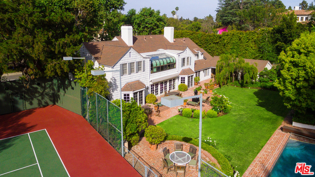 Incredible opportunity to renovate or develop in prime Beverly Hills location, north of Sunset Blvd. Situated on over an acre, this gated property features a main residence with 4 bedrooms and 6 bathrooms as well as a guest house with generous office and gym. The spectacular backyard features abundant patio space, intricate landscaping, pool and tennis court. First time on the market in over 40 years. Amazing potential for a developer - everything comes together on this property, or a perfect home for an owner/user.