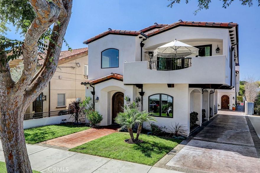 Tucked away on a serene, tree-lined street in South Redondo, 105 S Juanita Ave blends coastal living with refined design in a detached Mediterranean-style townhome that offers the privacy and comfort of a single-family home. Located just minutes from the beach, this custom-built residence by Dennis La Charite Construction (2017) with 4 bedrooms, 3 bathrooms, and a thoughtfully designed layout filled with premium finishes.



The upper level welcomes you into an expansive great room where vaulted ceilings, wide-plank oak flooring, and an abundance of natural light create an open, airy atmosphere. A spacious tiled deck—complete with a built-in gas line—extends seamlessly from the living area, ideal for indoor-outdoor living. The chef’s kitchen features Quartz countertops, high-end Wolf and Sub-Zero appliances, custom cabinetry, and a large center island with bar seating. A granite-faced fireplace serves as a cozy focal point in the adjacent living and dining areas.



The primary suite is a luxurious sanctuary with vaulted ceilings, a stone-accented fireplace, custom walk-in closet, and a spa-like bathroom featuring dual vanities, a walk-in shower, and a freestanding soaking tub. Also on the upper floor are a dedicated office space and a second full bathroom.



Downstairs, two spacious bedrooms share a well-appointed bathroom with dual sinks. This level also includes a laundry room and direct access to a finished two-car garage with epoxy flooring and storage space.



Located near top-rated schools, local parks, boutique shopping, and the iconic South Bay coastline, 105 S Juanita Ave offers a harmonious blend of luxury, comfort, and beachside convenience.