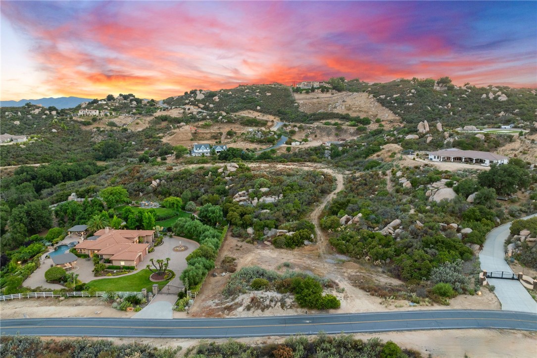 Experience the beauty of La Cresta Highlands with this stunning 4.85-acre parcel offering breathtaking panoramic views of rolling hills, lush landscapes, and unspoiled natural surroundings. This exceptional lot provides the perfect setting to build your custom estate, equestrian retreat, or private vineyard, all while embracing the tranquility of country living. A rare opportunity to enjoy peaceful rural life within minutes of modern conveniences, including award-winning schools, top-rated restaurants, premier golf courses, shopping malls, hospitals, world-renowned wineries, luxury resorts, and the I-15 freeway. Ideally located less than 1.5 hours from Los Angeles, San Diego, Palm Springs, beaches, mountains, and theme parks, this property offers the perfect balance of seclusion and accessibility. Immerse yourself in the La Cresta Highlands lifestyle with twinkling star-filled skies, scenic open space, private trails, the Santa Rosa Plateau Ecological Reserve, and vibrant community events. Truly a peaceful escape where nature meets luxury! Don’t miss this incredible opportunity to own a piece of Murrieta’s prestigious La Cresta Highlands community. Financing Available – Stated income loans with as little as 15% down and a 10-year fixed rate for qualified buyers.