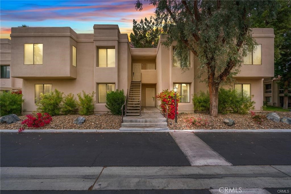 Experience the allure of Canyon Shore, a gated community that combines resort-style living with serene lagoons, fountains, and picturesque walking trails. This beautifully maintained 2-bedroom, 2-bath lower-level condo features a well-kept kitchen with a breakfast bar, a spacious dining area, and a large living room perfect for entertaining or relaxing. Step out onto the patio to find one of the community’s 5 pools, perfectly positioned for both convenience and privacy. Retreat to the spacious master suite and enjoy access to the clubhouse and gym. The community offers 7 tennis courts (4 lighted), a Pickleball court, 5 pools, 7 spas, and two dry saunas. Ideally located near Cathedral City’s entertainment district, restaurants, and a casino, this home includes one covered parking spot, ample guest parking, and an HOA that covers water, trash, and maintenance. Don’t miss your chance to own a slice of paradise!