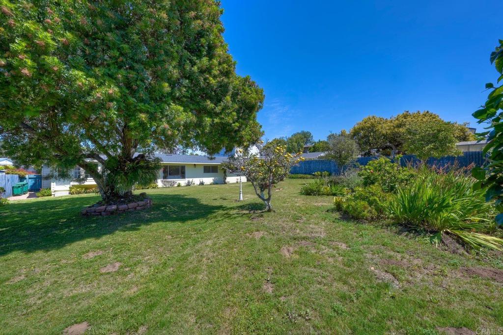 You will not want to miss this rare opportunity to own a custom-built 4-bedroom 2-bath home exuding storybook charm on a stunning, oversized lot—just minutes from the coast. Originally designed as a custom residence, this home offers a unique character throughout, from its one-of-a-kind curb appeal and welcoming covered portico to its raised foundation, original hardwood floors, and an abundance of large, light-filled windows. The expansive backyard is a true showstopper, filled with mature, fruit-bearing trees and endless potential. Whether you dream of adding a pool, ADU, or expanding the existing footprint, there's plenty of space to create your vision—without sacrificing outdoor living. Unlike flipped homes, this property retains its authentic charm and is perfect for those seeking a home with character and a lush, vibrant yard. Ideally located just 1.5 miles to the beach and close to all that matters—including highly rated schools like Magnolia Elementary, Valley Middle, Carlsbad High, and Sage Creek High. Enjoy the best of coastal living with easy access to Carlsbad Village, shopping, dining, and more.