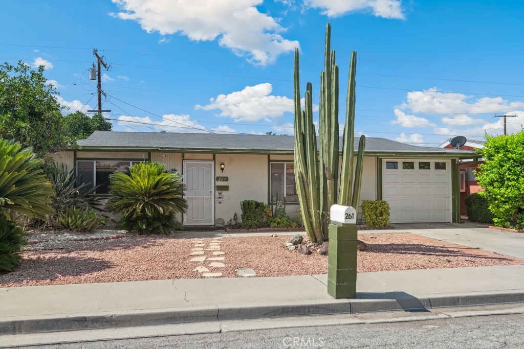 Charming Home in 55+ Sun Park Community with Great Natural Light & Prime Location. This charming home offers laminate wood flooring, great natural light, and a welcoming, spacious living room just off the entry. The open kitchen and dining area flow into a second living space, perfect for relaxing or entertaining. A slider door leads out to the covered patio, extending your living space outdoors. There is low-maintenance hardscaping with drought-tolerant plants. The home features two spacious bedrooms, a full bathroom, and a spacious laundry room with cabinetry and sink. Enjoy the convenience of direct garage access and a well-maintained interior. Residents of Sun Park enjoy access to a clubhouse, community pool, and beautifully maintained common areas. Ideally situated near markets, shopping centers, schools, and dining options, this home is the perfect blend of comfort, convenience, and community living.