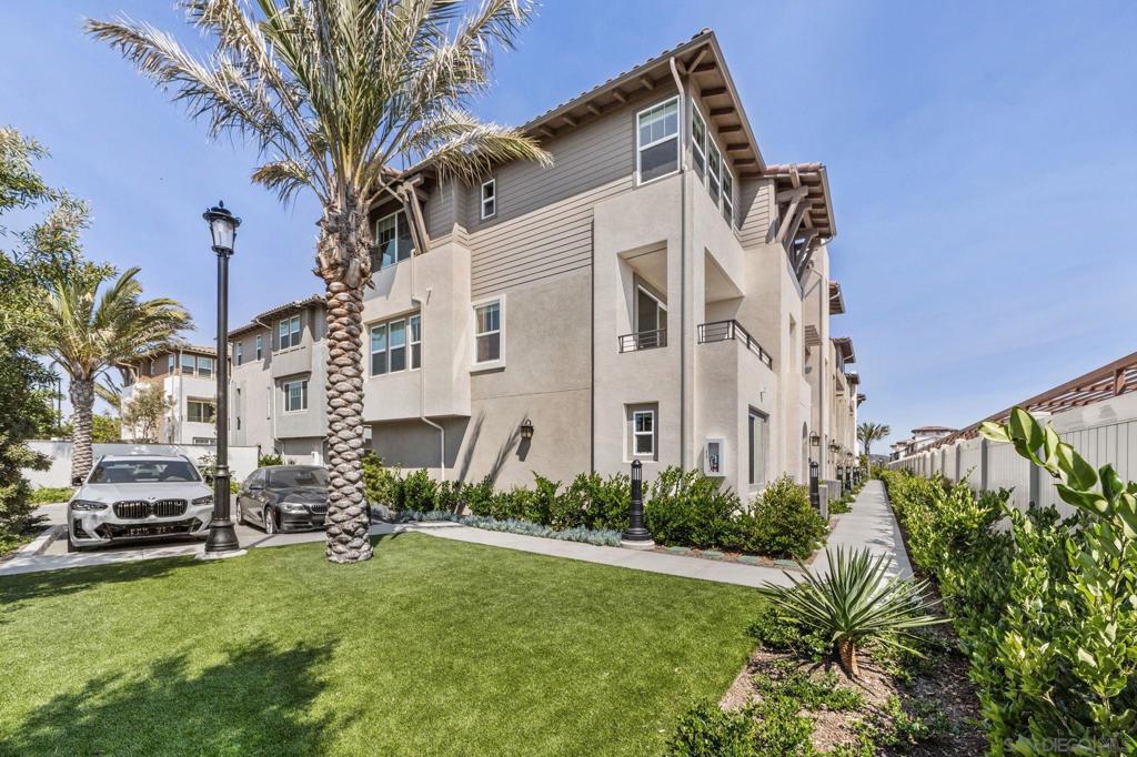 One of the most competitively priced per square foot newly constructed homes in Carmel Valley. Located in the Lumen community of Pacific Highlands Ranch, this 4-bedroom, 3.5-bath end-unit townhome sits in the most desirable location in the neighborhood—next to a semi-private parklet, with expansive views of Carmel Valley and peekaboo ocean views from the primary and second bedrooms. This light-filled home features over $100,000 in upgrades, including fully owned solar, high-end quartz countertops throughout, a striking waterfall island, and a full backsplash in the kitchen. Additional highlights include upgraded flooring throughout, luxury tile on all shower walls, soft-close custom cabinetry, enhanced recessed lighting in every room, custom window shades, and a finished garage with epoxy floors and ceiling-mounted storage racks. Fresh, modern interior paint adds the final touch. Top-of-the-line appliances—including a premium washer and dryer, as well as a reverse osmosis system—are included, making this home move-in ready. Residents of the Lumen community enjoy access to resort-style amenities, including a pool and jacuzzi, perfect for relaxing or entertaining. This turnkey property offers upscale living in one of North County San Diego’s most walkable and sought-after communities—close to top-rated schools, shopping, dining, beaches, and trails.
