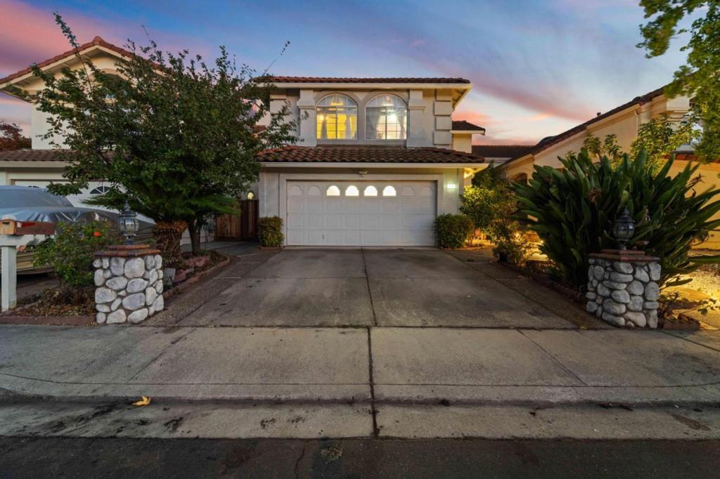 Discover your dream home in Milpitas' highly desirable Beresford neighborhood! This spacious, five-bedroom, three-bath residence offers a convenient location near schools, parks, shopping, and Freeways 880 and 680. Built by Shapell Homes, known for high-quality construction, this well-maintained property features laminate flooring throughout for easy maintenance and plantation shutters on the ground floor. The interior boasts a living room with a high ceiling, a cozy family room with a double-sided fireplace, and a separate dining area with recessed ceiling, providing ample space for entertaining or relaxation. Upstairs, you'll find four bedrooms and two baths, including a primary retreat that features a shower and a jet tub for a luxurious, spa-like experience. A convenient downstairs bedroom and full bath add to the home's versatility. Additional features include a dedicated study area, a downstairs laundry room, a granite kitchen countertop, a solar panels, a revamped front walkway, and access to a community pool, playground, and volleyball court. This exceptional opportunity won't last long! Schedule your tour today and make this inviting Milpitas home yours.