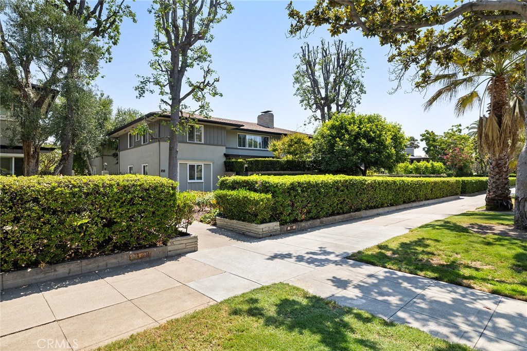 Top-floor 1,906-square-foot residence on Pasadena's Millionaires Row with three en-suite bedrooms. Oversized living room with enormous front window, crown molding, and built-ins connects to formal dining room with working fireplace and two-way dry bar leading to the kitchen with six-burner stove, abundant cabinetry, newer tiled counters, included appliances, and covered side-by-side parking spaces 34-35 with storage behind automatic gate—no tandem hassles. Two full bathrooms with built-in shower benches and pedestal sinks Third bathroom features a half bath and Washer Dryer. Front-facing orientation maximizes light while top-floor positioning eliminates overhead noise entirely. Well-maintained grounds with mature landscaping, pool, and BBQ areas. The complete package: nearly 2,000 square feet, chefs kitchen with six-burner stove for serious cooking, designated side-by-side parking with storage, absolute top-floor quiet, and Millionaires Row address without typical condo compromises. This home is in the staging area for the Rose Bowl Parade so owners have upfront views of the festivities! Don’t miss this opportunity!