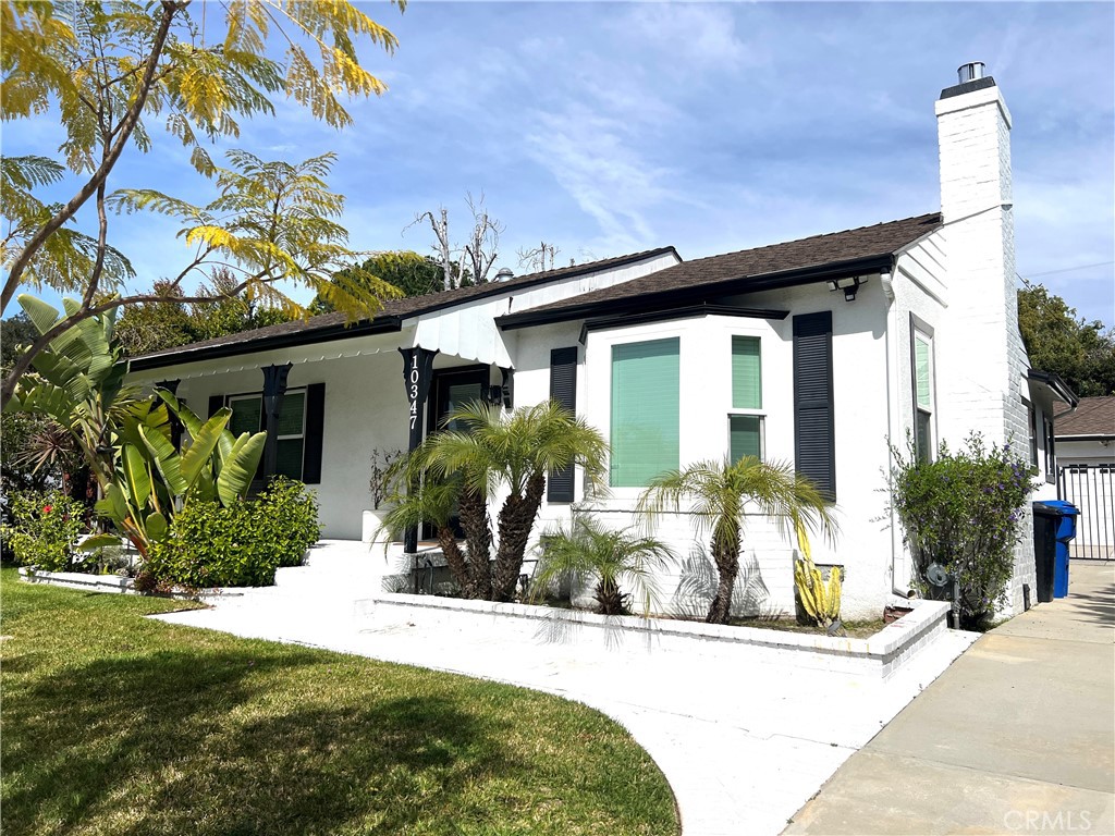 Perched on a well maintained street in the desirable Toluca Terrace, you will find this charming and thoughtfully updated home. As you enter the property, the spacious front yard and bright white exterior with black accents draw you in. Recently updated with new LVP flooring, the bright and spacious living room is the first space to greet you. Just off the living room is a quaint dining room that flows into the recently updated kitchen. Fresh white quartz countertops, subway backsplash and new tile flooring create an open and inviting kitchen space. Through the kitchen, you will find the private laundry room with newer appliances. At the front of the home sit both the primary and secondary bedrooms. Both rooms feature large windows that let through ample natural light and spacious walk in closets. Towards the rear of the home, you will also find an oversized den space with a separate office attached. As you enter the backyard oasis you are greeted by large palms growing from a generous lawn space, beautiful tall shrubs offering plenty of privacy and a 20 year old lemon tree that bears hundred of lemons per year. A large patio as well as a generous covered patio just off the garage, provide the perfect relaxation space. The extended driveway and two-car garage add to the appeal and utility. Other interior improvements include recessed lighting throughout, updated LVP flooring, updated kitchen tile, quartz countertop, subway backsplash, doubled paned windows in the front living room, primary and guest bedroom. Located near Burbank, Toluca Lake, No Ho Arts District, theaters, shops, restaurants, a library and multiple studios, this is a prime location and rare opportunity!
