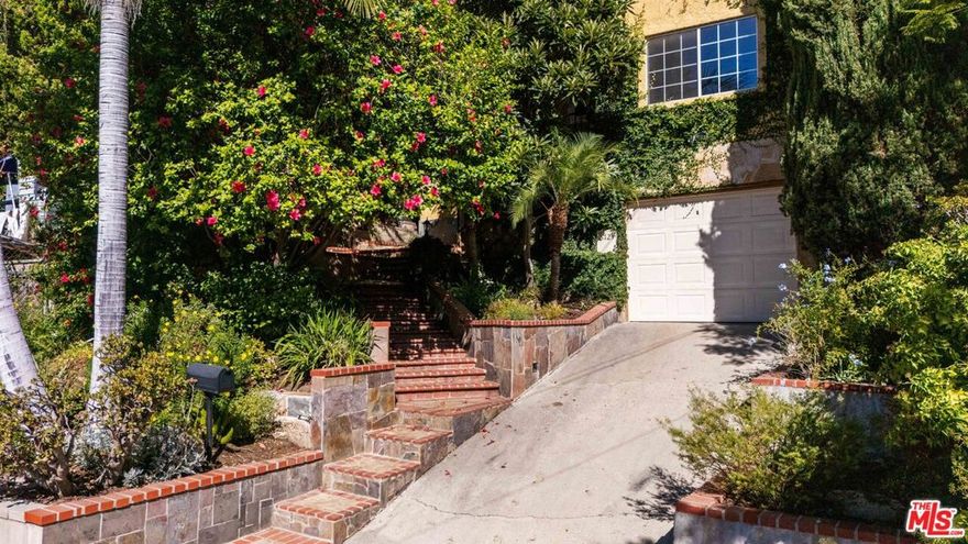 Lovingly updated by its current owner, this 3 bedroom, 3 bathroom, 1,683 square foot home in El Sereno, offers a layout with flexibility and flow where every detail has been considered. The home's original charm remains intact: warm light, built-ins, custom light fixtures, and thoughtful touches throughout make it feel lived-in in all the right ways. On the main floor, two guest bedrooms share a newly remodeled bathroom, while the upstairs full-floor primary suite feels like a private hideaway complete with a bonus space perfect for a study, yoga nook, or dressing room. Off the kitchen, a separate bonus space with its own entrance and full bathroom offers endless possibilities: art studio, guest suite, or creative office. Outside, the vibe continues. The front yard sits elevated from the street, surrounded by lush, irrigated landscaping for privacy and peace. Out back, a newly remodeled flagstone patio with barbecue invites long summer nights under string lights. There's parking in the garage plus additional space in the driveway, a large laundry room, and plenty of storage throughout. Located on a quiet, tree-lined street in the heart of Northeast LA, El Sereno is having a moment. It's central to Highland Park, South Pasadena, DTLA, and all the Eastside has to offer. Here, you'll find warmth, light, and ease.