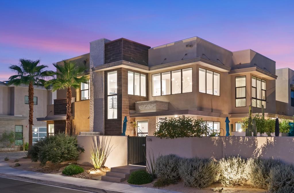Discover elegance and sophistication in this highly upgraded three-bedroom, three-bathroom home in the highly sought-after Vibe community. Tastefully finished with designer upgrades throughout, this light and bright two-story home features double-height ceilings that allow plenty of natural sunlight and picturesque mountain views. The open living space features wide plank tile floors, a gourmet kitchen complete with gray diamond quartz countertop with designer backsplash, large center island, upgraded stainless appliances and a fully retractable folding door that seamlessly blends indoor and outdoor spaces for entertaining. The open loft is perfect for a media room, office, or workout space and features custom built-in cabinets, a built-in coffee bar, and spectacular mountain views. The spacious primary bedroom offers the ultimate retreat with a large custom California walk-in closet, and a private outdoor patio with retractable slider. The newly updated primary bathroom has a spa like feel with a custom double vanity, Toto bidet, and rain shower. Not to be missed is the zen-like outdoor entertainment area complete with a Pebble Tec spool with waterfall feature, professionally landscaped yard, and several dining spaces, perfect for entertaining guests. Notable upgrades include owned solar, fresh paint, custom lighting throughout, motorized shades, two-car garage with frosted glass door and epoxy floor, tankless hot water heater, and high-end water filtration system. Community amenities include two dog parks, clubhouse with a large pool and spa, EV charging, and bocce ball.