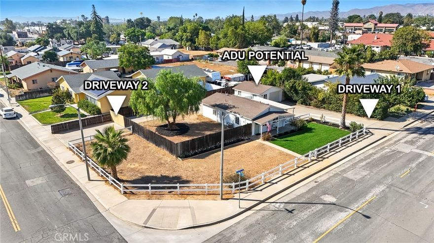 Welcome to 992 Park Avenue — a fully remodeled 2-bedroom, 1-bathroom home on a spacious 10,890 sq ft corner lot right on the Calimesa/Yucaipa county line, offering the best of both cities. Zoned Downtown Village Commercial (DVC), this versatile property allows for mixed residential and commercial use, making it ideal for a home business, rental income, or future development. The detached 450 sq ft garage resembles a standalone unit and could easily be converted into an ADU, studio, or office. With two driveways, gated RV/boat parking, and a fully usable lot, there’s plenty of room for storage, expansion, or outdoor living. Inside, although modest in size, the home offers impressive storage throughout, including a custom pantry, built-ins, and well-designed closet space. The bright living room features abundant natural light and a ceiling fan, and the home is equipped with central heat and air for year-round comfort. The kitchen has been beautifully updated with white oak cabinetry, a farmhouse sink, stylish backsplash, stainless steel appliances, and a cozy corner perfect for a built-in breakfast nook. The bathroom has been fully renovated, and there’s an indoor laundry room, new water heater, and waterproof wood-look flooring throughout. Major system upgrades include copper plumbing and full electrical rewiring by the previous owner. Step outside to enjoy mountain views from the covered front porch, fresh landscaping, and new ranch-style rail fencing that enhances the curb appeal. Plus, you're just a few doors down from the Calimesa Senior Center, offering daily activities and events for all ages, and around the corner from the brand-new public library — putting community resources right at your doorstep. Whether you're looking to live, work, or invest, this property offers endless potential in a growing and highly desirable area.