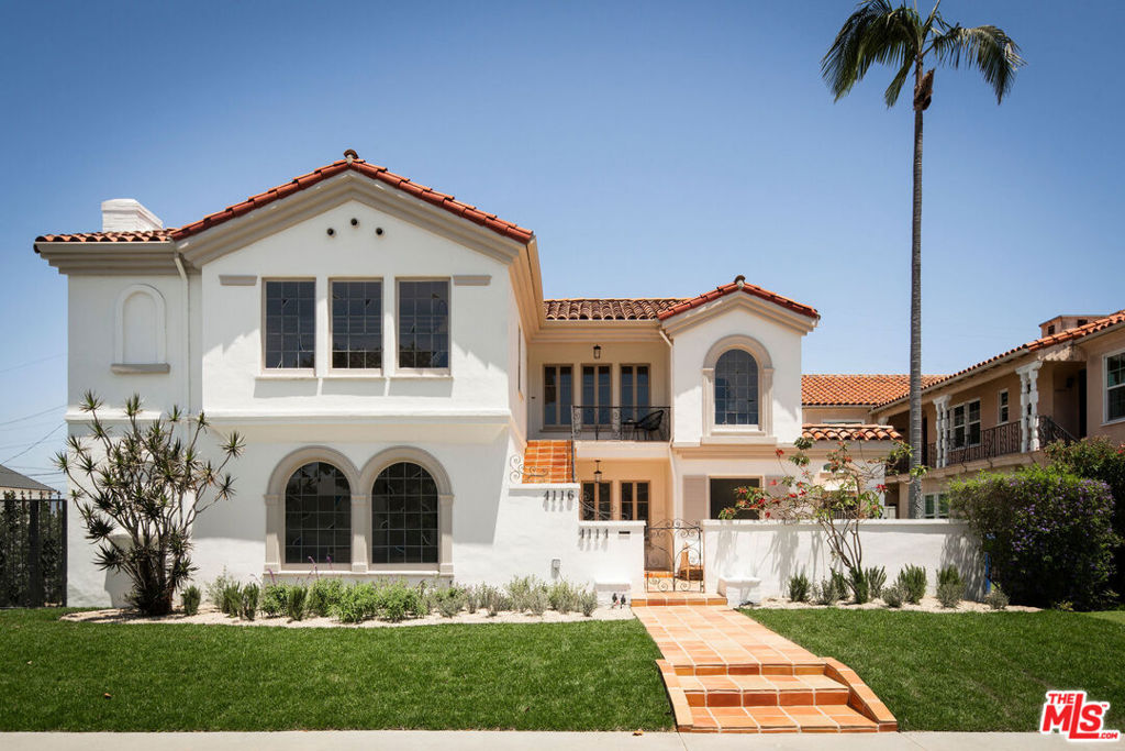 A beautifully restored, vacant Spanish duplex situated in the historic enclave of View Park Windsor Hills, offering timeless character, generous scale, and strong investment appeal. The property is a Contributor to the View Park National Register Historic District, making it potentially eligible for the Mills Act, which, if approved, would offer future owners the opportunity for significant property tax savings. Each impeccably designed and expansive 3 bedroom, 2 bathroom unit offers over 2,000 square feet of living space rife with original character. Set on a 7,521 sq ft lot, this rare and elegant two-unit building is delivered fully vacant ideal for both an owner-user and a design-minded investor. A spacious garage at the rear of the property, with alley access, provides ample parking or presents significant upside for potential ADU conversion. Beyond thoughtfully designed landscaping, an intricate iron gate and private courtyard introduce the property's classic Spanish detailing, paired with tastefully reimagined modern updates. A path of Saltillo tile leads to an expansive courtyard and upper patio, setting the tone for the elevated living experience within. Inside, both units showcase dramatic picture windows adorned with striking, perfectly restored stained glass, an artful focal point for the home's next custodian. Refinished hardwood floors, coved and tray ceilings, archways, and original built-ins further celebrate the property's rich architectural heritage and Spanish Revival design. The upper unit offers large living and dining areas, a decorative fireplace, and a sunlit kitchen with lovingly restored cabinetry and cheerful vintage tile. Three spacious bedrooms and two full baths, each with vintage tile, complete the layout, ideal for both families and professionals seeking charm, volume, and style. The lower unit mirrors the upper in layout and scale, while featuring newly renovated custom cabinetry, Arebescato and travertine countertops, and new Zia Tile in one of the bathrooms and the kitchen. The downstairs unit also features wedding cake plaster in the primary bedroom. Both residences enjoy high-design finishes and fixtures, including custom unlacquered and antique brass lighting imported from Europe, private laundry areas, ample closet storage, and designated garage parking. Perched above the city in one of L.A.'s most architecturally significant and close-knit neighborhoods, the property commands a presence on a serene tree-lined street, just minutes from Leimert Park, Culver City, Baldwin Hills hiking trails, and the new Crenshaw Line. A rare opportunity to own a legacy property in a storied community on the rise. Whether you're seeking a high-performing investment or a refined owner-user alternative to a single-family home, this Spanish duplex checks every box.