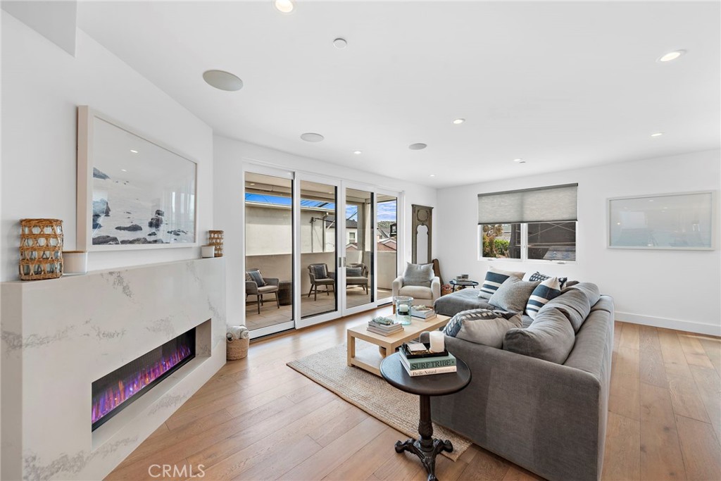 Sit back and relax in this beautiful contemporary custom built home, located in the coveted 300 block of the Corona del Mar Village. This beautiful three story rear unit boasts tons of natural light and an open floor plan. The living space has an open kitchen, dining area, fireplace and living room deck. The deck is the perfect space to entertain and relax. The kitchen features high-end appliances including a 6 burner stove, griddle, double oven, and built in refrigerator. The main level offers a master suite, living room, kitchen, powder room and a laundry room. The 3rd level leads to a loft, bathroom, and a secondary bedroom with en suite bathroom and walk in closet...and an oversized rooftop deck. This home is the ideal location with close proximity to shopping, dining, beaches and more! Please call today to schedule your showing!