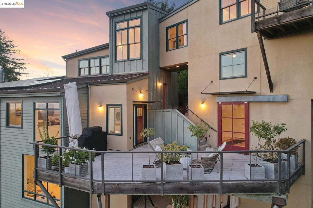 This stunning residence by noted Berkeley architect Geoff Holton is set on a rare ¾-acre hillside lot, offering breathtaking Bay & cityscape views. Built in 2004 with sustainable materials, the home blends seamlessly with its picturesque surroundings. A resort-style entry leads to the main door, grand deck & a separate studio entrance. The nearly 3,000 SF interior showcases a Scandinavian modernist flair, featuring warm wood & tile complemented by metallic accents. Expansive full-height windows & vaulted ceilings create an airy atmosphere, enhancing the indoor-outdoor connection. The spacious great room includes a cozy fireplace and a deck with stunning bay views. The gourmet kitchen is a culinary dream, featuring a one-piece wood breakfast bar, a sunny nook, and high-end appliances, including a Viking Pro range. The luxurious primary suite boasts a private deck, walk-in closet, & Jacuzzi, plus a bonus room ideal for a gym or den. The lower level offers a media room, guest wing, & laundry area, along with a tranquil zen hot tub overlooking the Bay - perfect for relaxation. Conveniently located just minutes from Berkeley's vibrant culture, with easy access to San Francisco, this property also offers potential for subdivision, an ADU, or a 2nd home. Berkeley postal, Oakland legal.