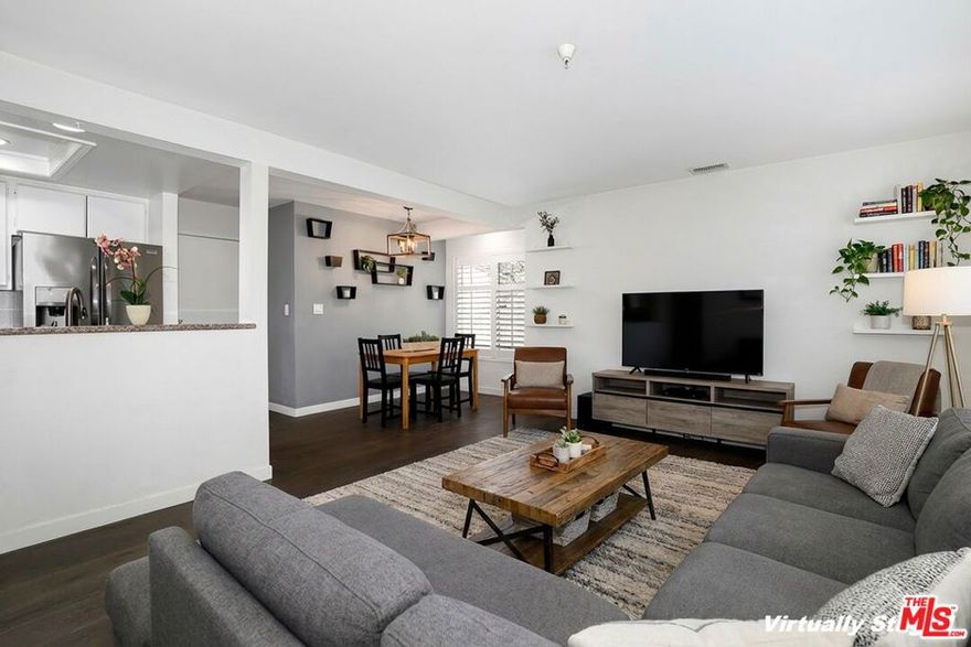 Perfectly situated in one of Pasadena's most desirable neighborhoods, this beautifully updated 2-bedroom, 2-bath townhome combines comfort, style, and convenience and is an end-unit with a private patio, offering nice privacy. The home welcomes you with wide-plank hardwood floors throughout and sophisticated porcelain tile accenting the spacious bathrooms. The open-concept main level features a bright dining area, a well-appointed galley kitchen with all necessary appliances, granite countertops, and a comfortable living room that opens to a charming private patio - ideal for morning coffee, reading, or relaxing with friends. Upstairs, you'll find two spacious bedrooms with ample closet space, sharing a full bath with a large vanity and a tub/shower combination. Your oversized, private two-car garage comes with an automatic opener and offers direct access into the kitchen for seamless everyday living. Tucked into one of the most private and sought-after locations within the community, this home offers a quiet retreat while still being just moments from public transit, Old Pasadena, South Lake Avenue, shopping, great dining options, and more. A wonderful opportunity to enjoy the best of Pasadena living.