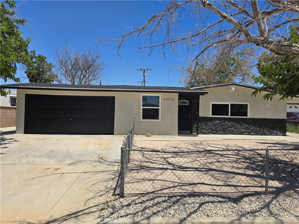 Welcome to 44510 21st St W — a completely remodeled single-family home offering 3 bedrooms, 2 bathrooms, and 1,543 sq ft of modern living space. This freshly updated property features luxury vinyl flooring throughout, recessed lighting, and central A/C and heating for year-round comfort.
The spacious kitchen is a standout, equipped with quartz countertops, stainless steel appliances including a stove, hood, sink, and dishwasher, and elegant white shaker cabinets. Both bathrooms have been tastefully renovated with new vanities and quartz counters.
The gated front and back yards offer added privacy and security—perfect for outdoor enjoyment. While the garage has been converted into a separate ADU (guest house), you’ll have dedicated driveway parking and receive a $150 monthly credit toward shared utilities used by the ADU tenants.