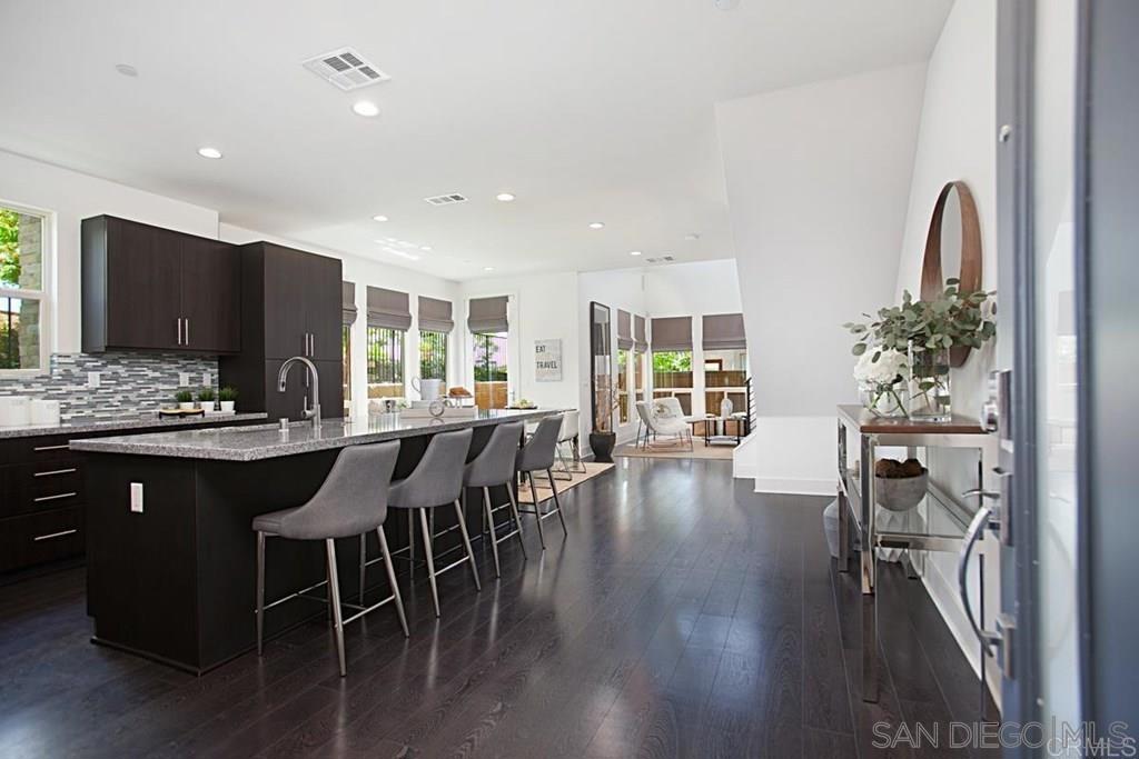 Elegant Rental in the Highly Desirable Civita Community @ Mission Valley Welcome to your new home, where modern design meets everyday comfort in one of Mission Valley’s most coveted neighborhoods. Step through the front door and you’ll be greeted by soaring ceilings, expansive windows, and an open floor plan that fills the home with natural light. This spacious Plan 4 Frame model has been beautifully upgraded with rich laminate wood flooring, granite countertops, a sleek glass tile backsplash, and stainless steel appliances. The kitchen is as functional as it is stylish, offering an abundance of cabinet space to keep everything organized and within reach. The home’s private backyard feels like your own retreat, complete with lush evergreen turf and a custom stone patio—perfect for hosting friends, dining al fresco, or simply unwinding in peace. Upstairs, the primary suite features a spa-inspired bathroom with designer tile, modern vessel sinks, and top-of-the-line finishes that elevate your daily routine. A generous bonus room crowns the top floor, offering sweeping hilltop views of Mission Valley. Whether you imagine it as a media lounge, home office, or personal sanctuary, this space invites endless possibilities. Located within the prestigious Civita community, this home places you in the heart of it all. Enjoy resort-style amenities, scenic walking paths, and quick access to vibrant shopping, dining, and entertainment. For added convenience, the home includes a washer and dryer, range and oven, fire sprinklers, a garage with opener, and full sewer connection.