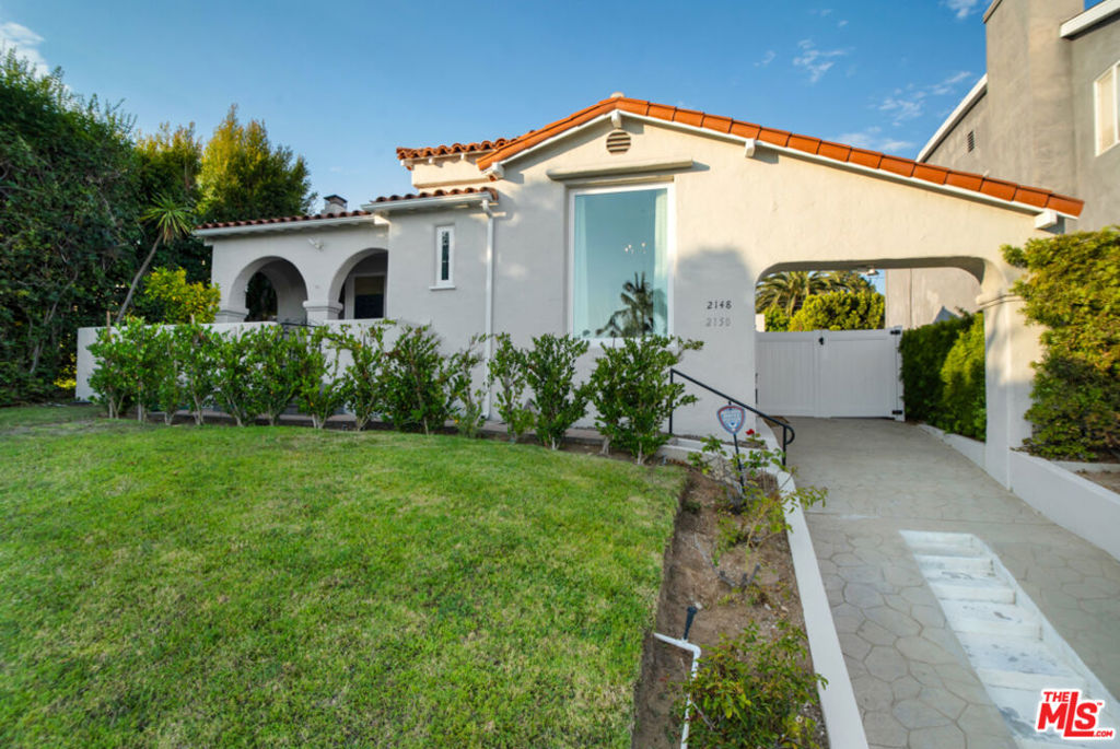 Welcome to this beautifully renovated Westside gem with new ADU, located in the highly coveted Westwood Charter School district! This stunning single-story 3-bedroom, 2-bathroom home blends timeless architectural charm with modern upgrades, located in one of the most desirable neighborhoods of Los Angeles. Perfectly positioned near UCLA, Google, Sony Pictures, Amazon, Century City, Beverly Hills, and Westwood Village, the location offers unmatched convenience and lifestyle. Inside, classic design elements such as barrel ceilings, gleaming hardwood floors, and a cozy fireplace create a warm and elegant atmosphere. The formal dining room is filled with natural light, while the adjoining breakfast room and service area offer the ideal setting for both casual and formal entertaining. The kitchen features custom cabinetry, granite countertops, stainless steel appliances, and direct access to the beautiful backyard perfect for seamless indoor-outdoor gatherings. A separate interior laundry room adds everyday convenience. The primary suite boasts a walk-in closet, bay windows, and direct access to a fully renovated bathroom. A second en-suite bedroom with its own private entrance provides flexibility for guests, a home office, or extended family. A third bedroom completes the thoughtful layout of the main home. Step outside to lush, landscaped grounds with mature fruit trees, a grassy courtyard, and a serene entertaining space that connects seamlessly to the new ADU, addressed as 2150 Prosser Ave. The 2-bedroom, 2-bath ADU offers endless possibilities: guest quarters, multi-generational living, home-based business, rental income, or student housing. Features include a full kitchen, living/dining area, interior laundry, and a tankless water heater. Some of the additional upgrades to the main home include: New HVAC system, new Milgard windows, renovated bathrooms, new privacy gates and new exterior and interior paint . This turnkey home with versatile ADU is a rare find in a prime Westside location!