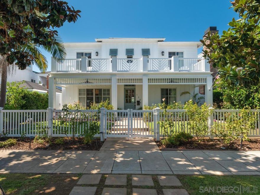Just steps from the bay and across from Bay View Park, this custom Coronado home combines coastal elegance with modern convenience in a relaxed yet sophisticated setting. Thoughtfully designed for indoor-outdoor living, the main level features engineered wood floors, a formal dining room, and a gourmet kitchen with premium appliances, quartz countertops, and a large center island that flows seamlessly into the living area with fireplace and out to a covered patio with BBQ, and grassy yard. A first-floor bedroom suite adds flexibility for guests or multigenerational living, while upstairs you’ll find three additional suites—including a primary retreat with fireplace, spa-style bath with soaking tub and rain shower, walk-in closet, and private balcony. Two secondary suites open to a covered veranda, and an expansive rooftop deck—accessible from both levels—offers sweeping views of the bay, San Diego skyline, and Coronado Bridge. Additional highlights include surround sound, custom wainscoting, plantation shutters, a security system, and a detached two-car garage with epoxy flooring, as well as extra covered parking for two and space for two in the alley. Ideally located near the ferry, shops, and dining, this home delivers quality, comfort, and the ultimate Coronado lifestyle.