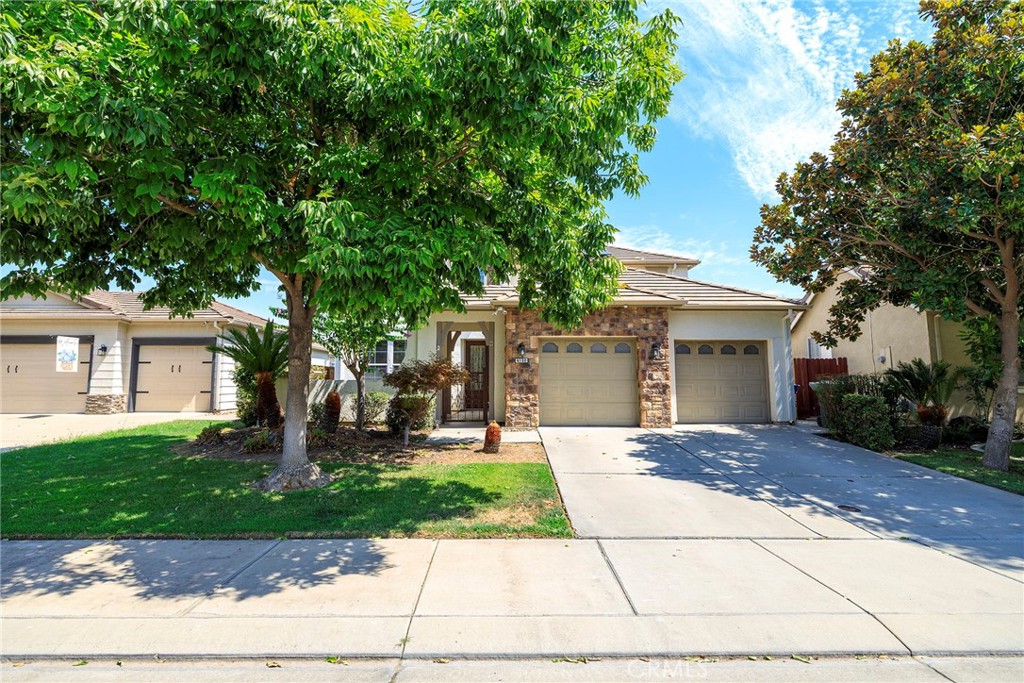This Merced Home with 5 Bedroom, 3,054sf of thoughtfully designed living space. The moment you arrive, you'll be welcomed by a charming front courtyard that sets the tone for the exceptional home beyond. Step inside to find beautiful hardwood floors flowing throughout expansive open living areas, perfect for both daily life and entertaining. The heart of the home features a generous kitchen with a large island and premium stainless steel appliances, ideal for culinary adventures and family gatherings. Downstairs Bedroom with full bath provides flexible living options for guests or multigenerational families. Upstairs, you'll discover a versatile loft space along with thoughtfully organized bedrooms featuring custom closet shelving systems. The upstairs laundry adds convenience to your daily routine. Throughout the home, custom built-ins maximize both storage and style. Outside, the freshly landscaped backyard offers a private retreat complete with a practical tool shed and attractive retaining planters. The 3-car tandem garage provides ample parking and storage. Best of all, the owned solar system means energy efficiency and lower utility costs for years to come. This family living space is quiet, desirable, and near Davenport Park. A Must See!!