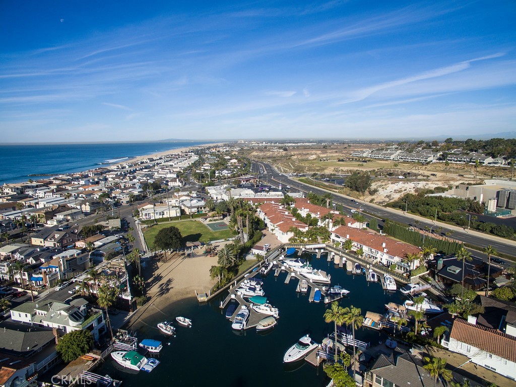 Newport Marina Villas is a secluded gated enclave with its own marina located just two blocks from one of the best surfing beaches in Newport. This newly remodeled 3 bedroom 2.5 bath town home includes a boat slip. You can escape to Catalina Island for the weekend or Bay Cruise in the harbor for hours and never see the same site twice. And when you have had your fill or whales and dolphins you simply come home. At Christmas you can organize your own Parade of Lights parties for friends and relatives. In addition to the large two car garage each unit is blessed with one additional car parking space. Residents enjoy both the bay and the beach without the noise, the crowds, or the traffic. When you hurry home from work to catch the afternoon swells rest assure you wont waste time finding a parking space. Walk to the newly upgraded Lido Village and Cannery sections of town. There are too many first rate shops. salons. and restaurant choices to mention. Mariners Mile is also a short walk away with its on the water fine dining and shopping.