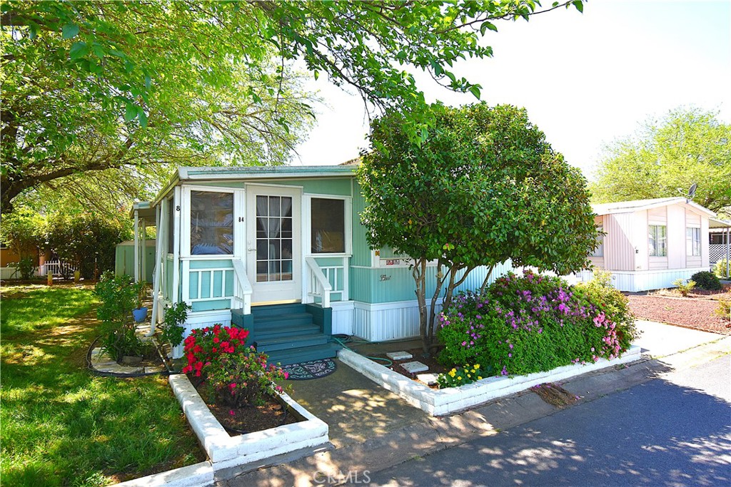 Welcome to your new home in the serene Lake Vista Senior Community, designed for those 55 and older. This charming 2-bedroom, 2-bathroom manufactured home offers a comfortable and inviting living space. Step in through the enclosed sunroom and find a spacious living room perfect for relaxation and entertaining. The home features a split layout with a bedroom and full bathroom on both ends. Washer and dryer are also included for your ease. Outside, enjoy a shaded yard and patio area and take advantage of the extra storage provided by the included storage sheds. Plus, residents can enjoy the community pool, perfect for staying active and socializing with neighbors. Don't miss out on this wonderful opportunity to join a friendly and active community.