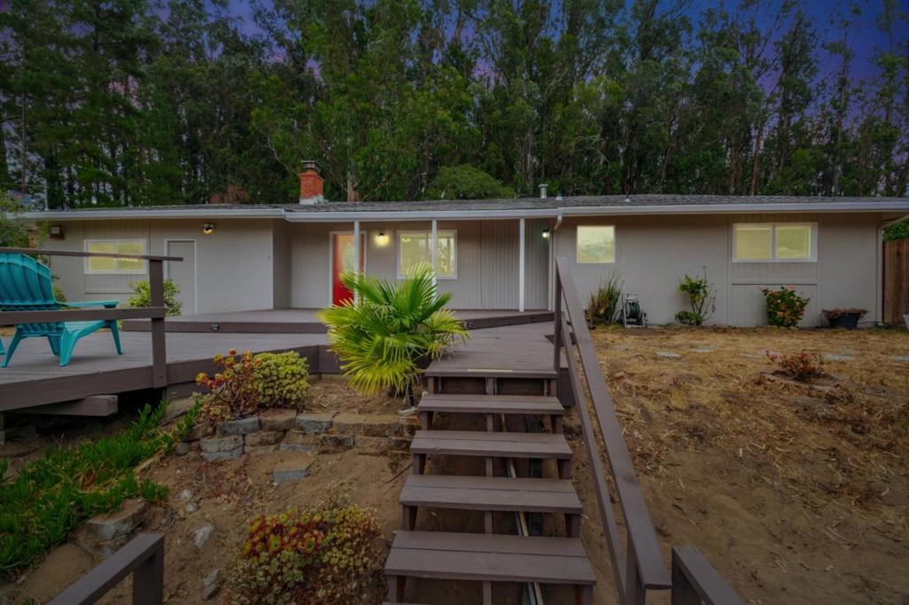 Welcome to this peaceful and private hillside home, freshly updated with a newly painted exterior and thoughtful interior improvements. (too many to mention, ask listing agent for the list) This charming 3-bedroom, 2-bathroom residence offers comfort, character, and the perfect setting to unwind. Also included, is a studio space which can be used as an office or an additional bedroom. Has its own bathroom and laundry hookups. Perched on a spacious half-acre lot at the top of a tranquil hill, you'll enjoy tree-lined surroundings and a refreshing ocean breeze just beyond the ridge. A generous deck provides a space to relax. With ample space for an RV, potential ADU, or a custom outdoor living area, this property offers flexibility for a variety of lifestyles. Whether you're seeking a peaceful retreat, a creative space, or simply a place to call your own, this hillside gem is ready to welcome you. Three (3) exterior facilities are included, that can be used for workshop or storage.