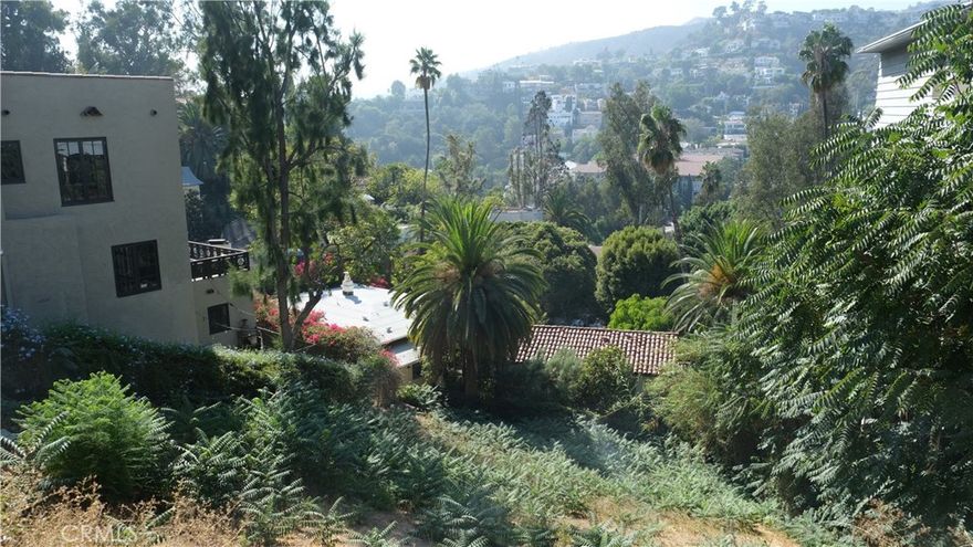 Lot located in historic Whitley Heights neighborhood of Hollywood Hills with clear westward view of Hollywood Heights.  Lot slopes downward from street.  Located in Whitley Heights Historic Preservation Overlay Zone.