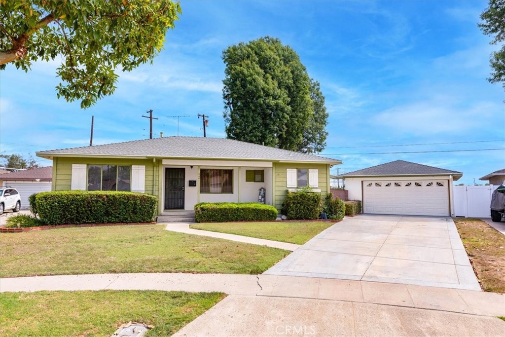 Welcome to this mid-century gem in North Long Beach, offering 3 bedrooms, 2 baths, and 1,386 sq. ft. of living space on a generous 7,262 sq. ft. lot. Built in 1957, this single-story home has been lovingly maintained and is ready for its next chapter.
Tucked away on a quiet cul-de-sac, the home features a spacious living room with hardwood floors, a brick fireplace, and sliding glass doors that open to the backyard. The kitchen includes a charming built-in breakfast nook and a recently updated oven. Convenient extras include an indoor laundry room, vintage bathrooms, and plenty of storage throughout.
Approximately 75% of the plumbing has been upgraded to copper, adding to the home’s solid foundation. Outside, you’ll find a detached two-car garage, long driveway, and ample yard space for outdoor living or gardening.
Centrally located near the 91, 710, and 605 freeways, this property offers easy access to surrounding cities, shopping, and parks. With timeless character and lots of potential, it’s a fantastic opportunity for buyers looking to put their own touch on a well-loved home.