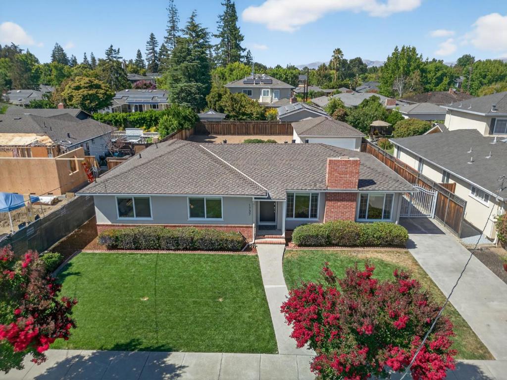 Charming one story Willow Glen ranch home on an impressive 9656sf lot! Located on a wide, tree-lined street, surrounded by beautiful homes, this lovely residence has preserved a few of its vintage elements - like the attractive mouldings and tiled kitchen and baths - and has added modern must-haves such as updated electrical, dual pane windows, indoor laundry (adjacent to kitchen), beautifully refinished floors, high quality roof and more. The home is set forward on the parcel, facing South, and creating a huge amount of potential in the back portion of the lot for home expansion, ADU or out-buildings, pool, sports court, gardens, etc. The neighborhood is quiet and attractive, and is close to Meridian Ave, for all the conveniences you need - the location of this home is centrally located between downtown Willow Glen and downtown Campbell, two very popular walkable towns with shopping, dining, farmer's markets and fun.
