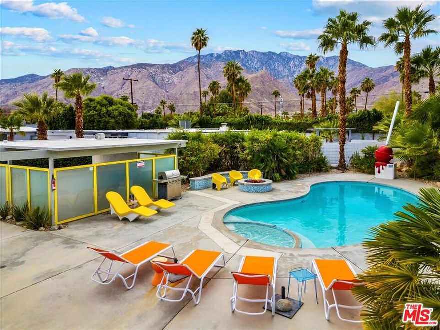 A striking Mid-Century "Alexander" nestled in the heart of Palm Springs, 888 E Janet Circle captures the effortless elegance and relaxed sophistication that define desert living. Set on a quiet cul-de-sac, this residence offers privacy, style, and sweeping mountain views that frame every sunset in perfection. Step through the glass entry into an open, light-filled interior. The great room features floor-to-ceiling windows, terrazzo tiled floors, and seamless indoor-outdoor flow, ideal for both intimate gatherings and grand entertaining. The chef's kitchen, opens to a private outdoor oasis with a sparkling pool, spa, and fire-pit designed for year-round enjoyment. Each bedroom is a sanctuary, with all bedrooms including the primary suite offering direct access to the rear and side patios. Every detail, from the designer finishes to the curated landscaping, reflects a commitment to timeless design and mid-century modern comfort. Located minutes from downtown dining, shopping, and the vibrant Palm Springs art scene, this home embodies resort-style living with everyday ease. 888 E Janet Circle isn't just a residence, it's a statement of refined mid-century modern desert luxury.