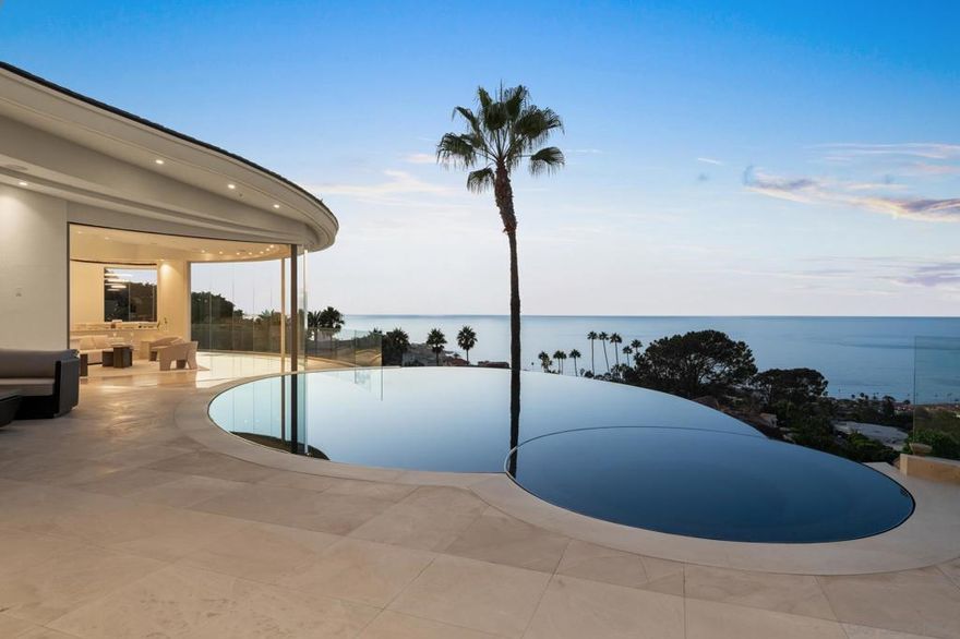 Mesmerizing and unobstructed views will amaze and delight in this recently and completely reimagined showstopper. With masterful precision, the home’s harmonious curvilinear design artfully reflects the soft arcs and bends of the coastline and sea. Interior and exterior spaces feature high-end selections from the Miele appliances and upgraded temperature-controlled wine cellar to the white oak flooring and exceptional cabinetry and ceramic tiles. Nearly every room showcases spectacular front-row ocean vistas, complemented by an expansive west-facing pool and spacious entertaining deck perfect for gatherings.
