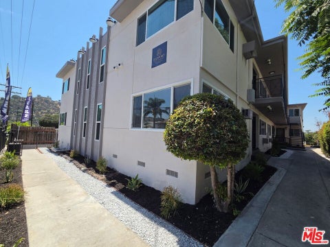 Photo of 9949 Pinewood Avenue #1, Los Angeles, CA 91042 (MLS # 26874163)