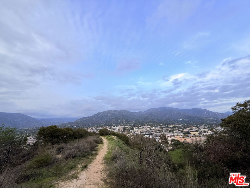 INVESTORS* - An exceptional development opportunity awaits to build multiple single-family homes and ADUs, or even consider manufactured homes, across all the lots. Alternatively, merge the parcels to create one or two expansive estates, or design a bespoke home on each lot. Imagine your dream home elevated on a stunning vantage point, offering sweeping panoramic views of the city skyline and majestic mountains. Included are beautifully designed renderings to help you envision the possibilities for your future development. This is a unique chance to create a thoughtfully planned neighborhood that offers both privacy and tranquility. A prior survey and soil report confirmed that the surface bedrock was ideal for building. Recent development nearby, including a newly built home and another currently under construction. Utility poles are conveniently close by. The Seller prefers selling all six lots together but will consider offers for a three-lot split. If splitting, APNs ending in 004, 005, and 006 are priced at $64,000 per lot, while APNs ending in 007, 008, and 009 are $54,000 per lot. 9727, 9735, 9739, 9741, 9745 and 9749 N Estaban Way. Respective APNs: 2563-030-004, 2563-030-005, 2563-030-006, 2563-030-007, 2563-030-008, 2563-030-009.