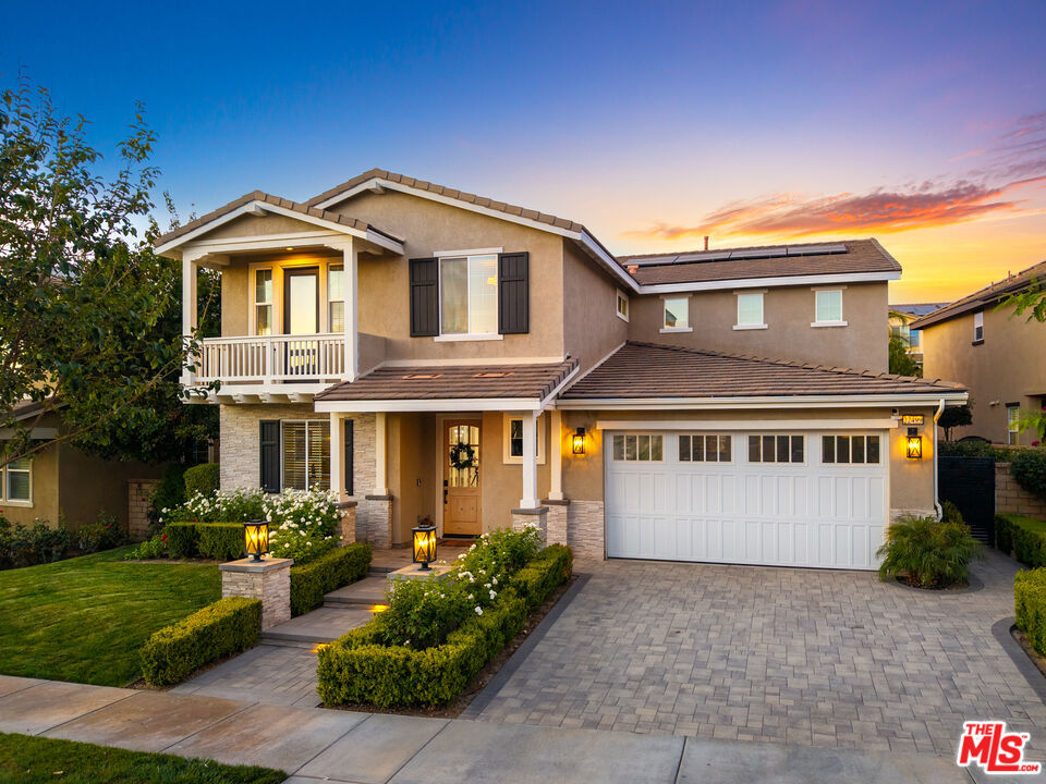 *TurnKey River Village Pool & Spa Home with Custom Upgrades, No Mello-Roos*...Resort-style living awaits at 22499 Leaf Spring Ct, a beautifully upgraded 5-bedroom, 3-bathroom home in Santa Clarita's sought-after River Village community. Blending elegance, comfort, and a true turn-key lifestyle, this residence showcases custom details throughout and a backyard designed for entertaining. The main level welcomes you with an inviting living room featuring a marble-tile fireplace, custom mantel, built-in bookcases, and surround sound extending outdoors. The dining area boasts a custom hutch, window seating, and a butler's pantry with wine fridge, while the adjacent kitchen flows seamlessly into the family room and private backyard. A full bedroom and bathroom downstairs provide ideal space for guests or multi-generational living. Upstairs, retreat to the luxurious primary suite complete with a spa-like bathroom offering marble finishes, a frameless glass shower, soaking tub, dual vanities, and a spacious walk-in closet with custom cabinetry. A single glass door opens to a private balcony overlooking the backyard oasisperfect for morning coffee or evening sunsets. A generous loft provides versatile space for a media room, lounge, or play area. Three secondary bedrooms and a remodeled laundry room complete the second floor with both style and functionality. Thoughtful upgrades elevate every corner of the home: built-in desks and cabinetry, detailed wainscoting, freshly painted interiors, a finished garage with epoxy floors and insulated door, and a whole-home water softener system for added comfort and convenience. The backyard is a private retreat with a sparkling pool, relaxing spa, covered patio, and fully equipped outdoor kitchen with bar seating. Custom pavers, exterior lighting, and a generator hook-up add both charm and functionality, creating the perfect setting for entertaining or unwinding at home. River Village residents enjoy access to a pool, clubhouse, and parks, with nearby hiking trails, bike paths, and Duane R. Harte Park just steps away. Families will also appreciate the home's location within the highly regarded William S. Hart Union High School District, plus its central proximity to shopping, dining, and the Westfield Valencia Town Center. The property also offers the rare advantage of no Mello-Roos tax and energy efficiency with a solar system under PPA. Combining turn-key living, custom finishes, a remodeled primary suite with private balcony, and a resort-style backyard, this is one of River Village's premier homes. Don't miss your chance to make it yours.