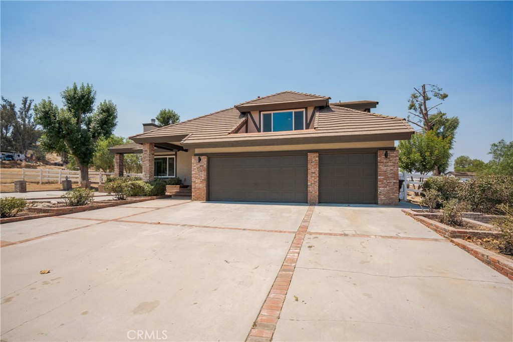 If you’ve been dreaming of a place where your horses can thrive and your family can feel right at home, welcome to 31755 Country Haven Ln. Set on 2.53 private, flat, gated acres, this 4-bedroom, 3.5-bath, 3,482sf. fully remodeled estate blends modern luxury with country charm. A 3-stall stable with attached tack room, 5 corrals, and a separate gated 1,500sf. RV garage/workshop with bathroom provide everything you need for the ideal equestrian lifestyle. The property is also on its own well, meaning no water bills, a valuable feature for acreage living.
Inside, the home shines with new windows, fresh flooring, and a chef’s kitchen with custom cabinetry, quartz counters and backsplash, and premium Frigidaire Professional appliances. The formal living room boasts soaring ceilings and a cozy fireplace, while the spacious family room with wood-burning stove and wet bar is perfect for relaxing or entertaining.
Upstairs, the master retreat is a true sanctuary, featuring a sitting area, fireplace, and private deck. The spa-inspired bath offers dual vanities, a free-standing soaking tub, oversized walk-in shower, and Delta steam shower, while the custom walk-in closet adds everyday luxury. Move-in ready and minutes from shopping, schools, and freeway access, this turnkey property is a rare find where comfort, style, and the equestrian lifestyle come together.