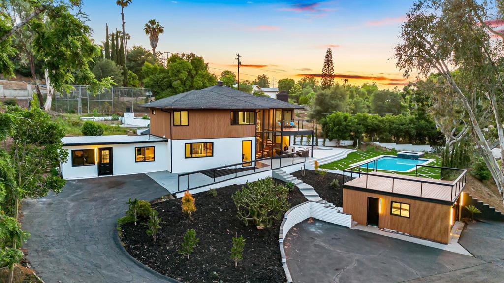 Turn-Key Modern Oasis at 2101 Monte Vista Dr, Vista Discover your fully rebuilt, move-in ready dream home on a private acre in Vista’s desirable Alta Vista area. Completely reimagined in 2024 with brand-new plumbing, electrical, roof, luxury finishes, and smart-home touches—this is a true turn-key masterpiece. Enjoy over 4,600 sqft of designer living space with 6 bedrooms, 4.5 bathrooms, a home theater, gym/sauna, and dual primary suites. The main home features a stunning floating mahogany staircase with LED lighting and a spacious primary retreat with a private balcony. The attached JADU (studio with full kitchen, bath, laundry) is ideal for guests, family, or rental income. Your private resort-style backyard includes: Saltwater pool + spa with Wi-Fi/Bluetooth controls & waterfalls Built-in sunken fire pit for unforgettable gatherings Rooftop deck over the detached 2-car garage with beautiful mountain views Basketball/pickleball court plus a huge driveway for all your guests Location perks: Minutes to Hwy 78, shopping, restaurants, breweries, golf, parks, and great schools No HOA, low maintenance, and designed for ultimate entertaining—just invite your friends and enjoy. This is the place everyone wants to be. Call your agent today. In a prime location just minutes from freeways, shopping, and dining.