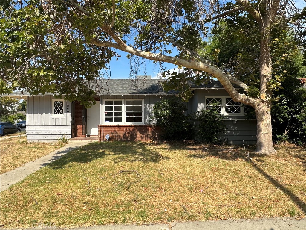 Incredible opportunity for investors or end-users looking to bring their vision to life. Located on a desirable corner lot in the heart of Van Nuys, this 3-bedroom, 2-bathroom home offers approximately 1,386 sq ft of interior space with a detached 2-car garage and a spacious 8,071 sq ft lot—ideal for expansion, renovation, or possible ADU addition (buyer to verify). The home is a true fixer-upper featuring original mid-century details including vintage wood kitchen cabinets and hardwood-style flooring. The interior needs cosmetic updates, paint, and kitchen/bath remodeling. The backyard is deep and open with mature landscaping and plenty of space to create a dream outdoor oasis or entertainment area.Additional highlights include a large living room, formal dining area, and generous front yard with curb appeal potential.Sold As-Is. This is a fantastic canvas for your next flip, rental, or primary residence renovation. Close to schools, shopping, dining, and easy access to the 405 and 101 freeways.