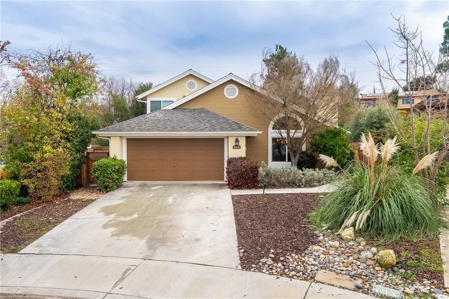Welcome to 940 Austin Court! Tucked at the end of a cul-de-sac in an established Paso Robles neighborhood, this home offers space, contemporary updates and lifestyle on a generous .225± acre lot. A mature landscaped approach creates an impactful first impression, drawing you to the front door. Inside, 1,756± sq ft of living space showcases an open-concept main floor with vaulted ceilings and an abundance of natural light. The dining area features a large picture window overlooking contemporary landscaping, while the living room centers around a gas fireplace with stacked stone surround that could be used for relaxed evenings or hosting guests. The kitchen has been thoughtfully improved in 2025 with newly installed cabinets and hardware, contemporary black subway tile backsplash, updated counters, single deep-basin sink, stainless steel appliances and a custom built-in buffet/coffee bar with decorative glass-front hanging cabinets—blending function with design. An updated sliding glass door with integrated pet door connects the kitchen to the rear yard for seamless indoor-outdoor living. The first floor is complimented with engineered wood floors in the living room, dining, and kitchen areas, and includes indoor laundry, 2 guest bedrooms plus a full guest bath for family, guests or home office needs. Upstairs, the private primary suite provides separation and comfort, featuring a spacious layout and ensuite bath with dual vanities. Outside, the rear yard is a space for versatility with DG walkways, a flagstone paver patio and an accent olive tree framed by stacked pavers. The oversized side yard offers ample room for potential entertaining, gardening projects or future customization. A 2-car garage, newer energy efficient dual paned vinyl windows throughout and solar with an EV charger may add efficiency and possible long-term value. Explore Paso Robles’ Downtown City Park, the hip industrial vibes of Tin City, and the iconic Sensorio Field of Lights, this home puts the Central Coast at your doorstep.