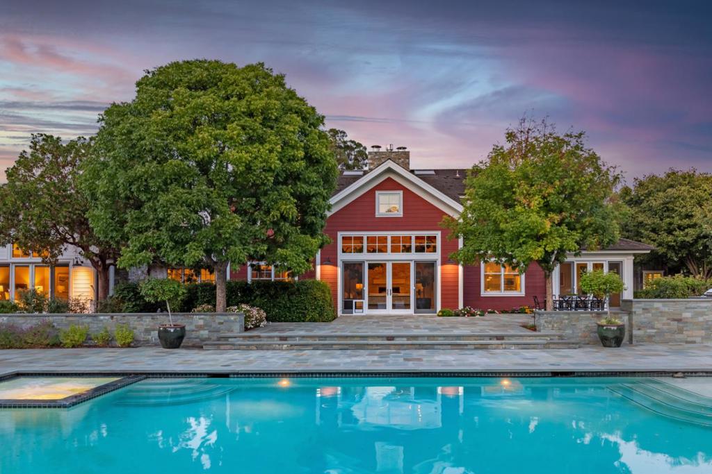 New Price! This magnificent contemporary farmhouse is situated on 3+ flat acres with spectacular views of the Western Hills and is within easy walking distance to the Woodside School (preK-8th grade) and Town Center. A testament to timeless architecture, meticulous craftsmanship and designer details, the main home and guest house were newly constructed in 2012 by renowned builder, Pacific Peninsula Group. Nothing short of exceptional, the 4 bedroom main home has high end finishes and white oak floors throughout, a state-of-the-art chefs kitchen and a eye catching two-story great room with rustic wooden beams and a honed limestone two-sided gas-fed fireplace. This estate's flat 3+ acres, which include a detached 1,255 sf elegant one-bedroom guest house, are elegantly fully utilized between the natural front equestrian pasture, the rear pool, spa and large entertaining terrace, the wisteria-framed fire pit, a 6-raised bed vegetable garden, chicken coop, dog run and fenced corrals. Privacy, entertainment options and enviable location, this property has it all!
