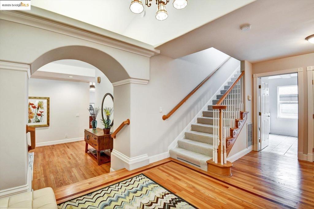 Perfectly located with easy access to UC Berkeley, San Francisco and thousands of acres of Tilden and contiguous East Bay Regional Parks, this hospitable Norfolk Road home’s generously sized rooms and flexible design exceeds standards for modern lifestyles. Main level’s spacious kitchen with walk-in pantry and adjoining great room communicate easily with home office, guest suite and laundry room. Living/dining room opens to new decks. Lower level’s principal bedroom with walk-in closet and bath with spa tub open onto private and tree-secluded decks. Level-in driveway, low maintenance landscape. Views of San Francisco skyline and all five bridges from Grizzly Peak, a short walk up the hill along regional bicycle trail. Rockridge BART, AC Transit. Congenial, cooperative neighbors and neighborhood.