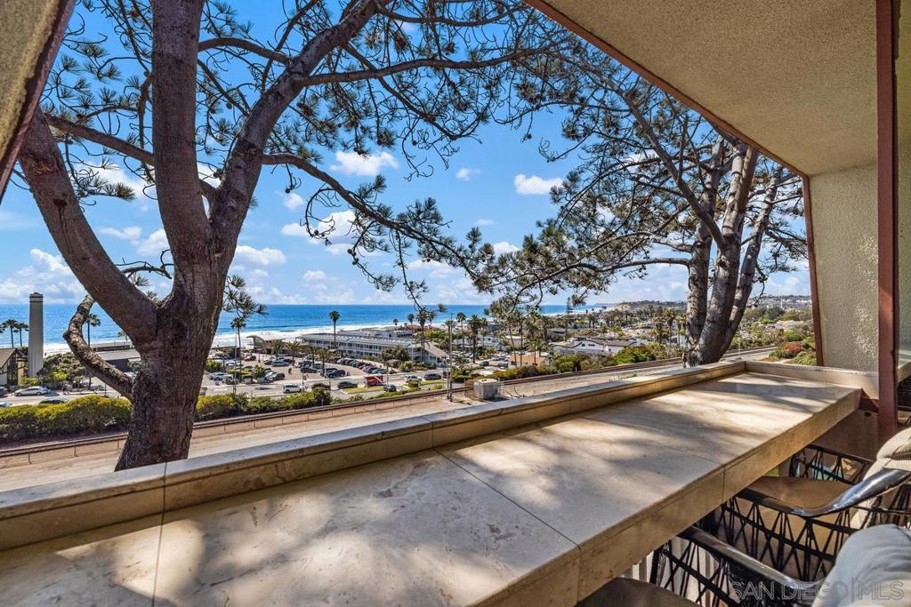 Discover L'Auberge, Your Private Oceanfront Sanctuary in Del Mar. Rarely available, this luxury L'Auberge condominium home is more than just a residence – it’s a lifestyle. Imagine waking up to sit-down white water ocean & beach views from every room, a panorama that stretches across Del Mar's pristine coastline. This private chateau, your perfect pied-à-terre, immerses you in the resort life, offering breathtaking sunsets and the unparalleled luxury of the world-class L'Auberge Resort & Spa. The versatility of the property may also serve as a high income investment/vacation rental or second home. As a resident (or tenant), you'll enjoy complimentary access to all resort amenities: sparkling pool & spa, expansive decks, lit tennis & pickleball courts, gym, and the elegant hotel guest grand lobby. Here, sublime peace awaits. Your King-sized primary bedroom features a comfortable sitting area and a private ocean-view balcony, complemented by a full en-suite bath/cedar-lined walk-in closet. An open guest space (lives like a second bedroom) offers built-in-wall queen size bed w/ fabulous white water & coast views, dining area, fireplace, built-ins & shelves w/ second full bath. The inviting dining area, cozy fireplace, and thoughtful built-ins create an atmosphere of refined comfort. Entertaining is a delight in the gourmet kitchen, equipped with stainless appliances and abundant cabinet/storage space. Convenience is key with parking for two guest cars and an additional assigned underground space, with a direct, no-steps elevator to your lobby and floor. Beyond your exquisite home/investment, discover Del Mar's quaint small-town charm and its natural coastal playground. As a Del Mar local, you’ll love exploring nearby Seagrove Park and the Torrey Pines State Nature Reserve, hiking along wild stretches of land and coast, home to diverse seabirds, including the California Pelican. Destination Del Mar offers incredible diversity: world-class surfing, sailing, yachting, theater, unique shops, boutique hotels, and award-winning cuisine. It's also home to the famous Del Mar Racetrack and the San Diego County Fair. Experience the amazing coastal life and unforgettable sunsets in this charming seaside village, blending striking natural beauty with a touch of European allure. Del Mar Race Track July 18th through Aug. 21st, Breeders Oct. 30th through Nov. 30th.