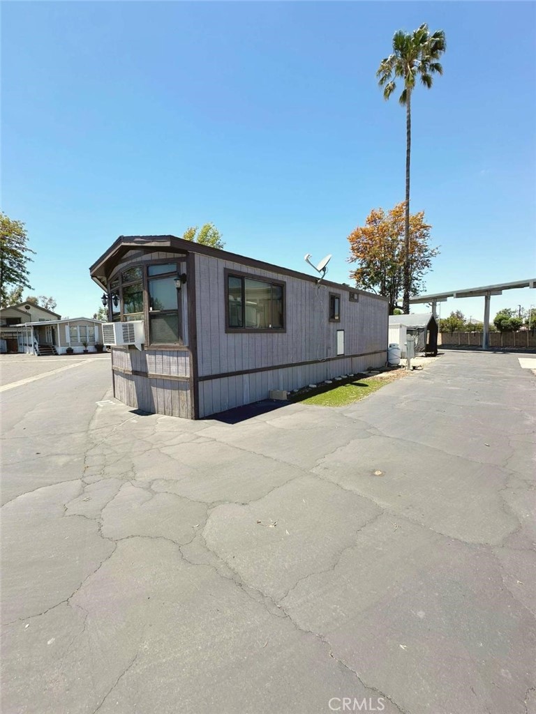 Gorgeous one of a kind Park Model very Spacious situated on a Corner Lot. This Home has plenty of parking enough for 4 cars. The home has an open floor plan. This home has a very open floor plan with natural light. This home has an enclosed california patio that can be converted into a 2nd Bedroom and an additional family room. This home has a brand new stove and a brand new refrigerator. Hurry this home will not last.