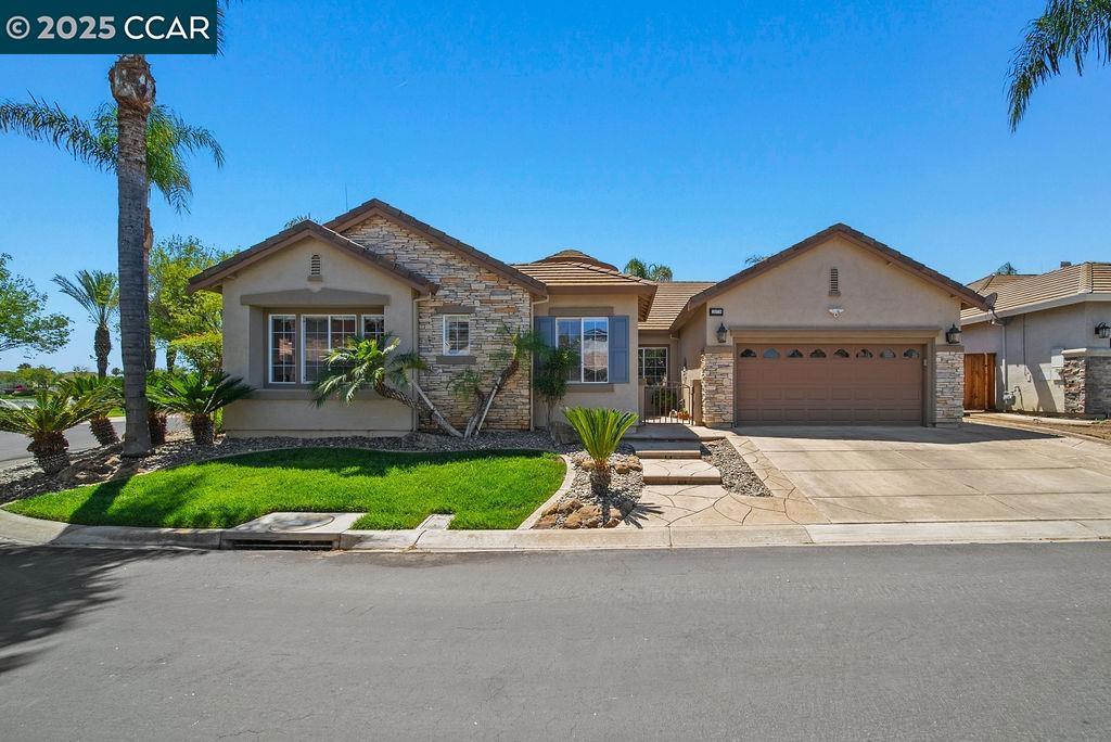 Nestled in the highly desirable Lakeshore gated community, this beautifully maintained 3-bedroom, 2.5-bathroom single-story home boasts a corner lot directly across from the lake. Step inside to a well-designed floor plan featuring generous living spaces, abundant natural light, and versatile areas perfect for relaxing and entertaining. Each bedroom offers privacy and comfort, including a primary suite with its own en-suite bathroom. The dedicated den provides a quiet workspace ideal for a home office. The tandem finished garage is perfect for parking your boat, trailer, collector car or additional storage. The true highlight of this home is its beautifully landscaped backyard, providing ample space for gatherings, barbecues, or simply unwinding in privacy. Some added features include upgraded tile and flooring, crown moulding throughout, whole house fan, custom window coverings, Alumawood lattice patio cover, PureFlo water conditioner, new fencing, newer exterior paint. As a resident of the Lakeshore community, you'll enjoy access to a scenic lake, BBQ area, community pool, guest parking, playground, picnic area and serene walking trail. Residents have the added benefit of a full time security gate.