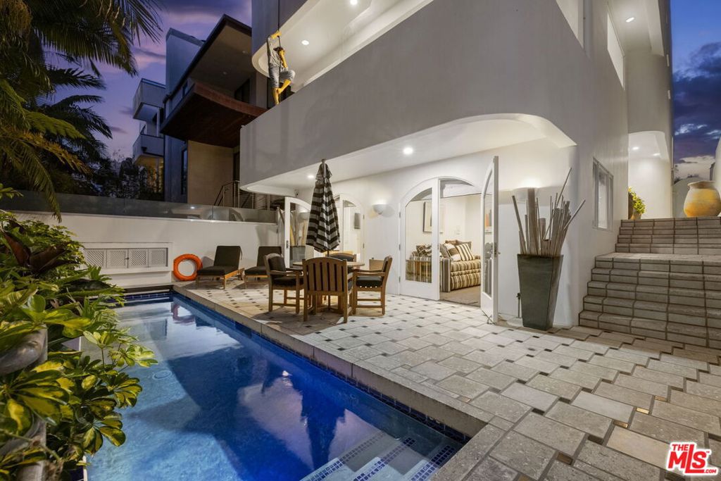 ** FIRST TIME EVER ON MARKET ** Totally custom, and truly one-of-a-kind Mediterranean Architectural in Marina Del Rey's Silver Strand. Just steps away from the Lighthouse Bridge, beach and Marina boat slips, this light, bright and cheerful beach oasis exudes class, elegance and impressive attention to detail; a home where bespoke material and design choices harmoniously blend with practical, everyday luxuries and conveniences... Notable amenities include wood floors, fireplaces on all 3 levels, a great entertainment living room with views onto verdant Mast Mall greenbelt, spacious formal dining, beautiful modern kitchen equipped with premium appliances including Sub-Zero, Bosch..., modernized baths + an open concept family room plus an additional separate office. The true piece de' resistance is its master suite sanctuary that encompasses the entire top floor, with an obscene amount of closet, drawer and storage space curated for the most discriminating and compulsive wardrobe "enthusiasts", plus a mini service cubby w/ sink and 2nd laundry. Lots of additional, unique storage solutions provide for shoes, hats, and a see through glass display cabinet perfect for showcasing your collections and curios, all leading out to a private Jacuzzi deck perfect for enjoying sun-lit days and intimate nights. 2 additional brs & 1 full bath on 1st level overlook lap pool w/ adjacent dog run, 3-car side by side garage with an extremely handy dumb waiter especially convenient for bringing your groceries from your car up to the kitchen. 24/7 neighborhood patrol . (Tax rolls show 4,152 feet, however attached floor plan reflects 3,550 ft for house + 612 for garage). This truly special one-owner home has never been offered before, so come find 120 Mast Mall- where invigorating ocean breezes intersect with all around good vibes....