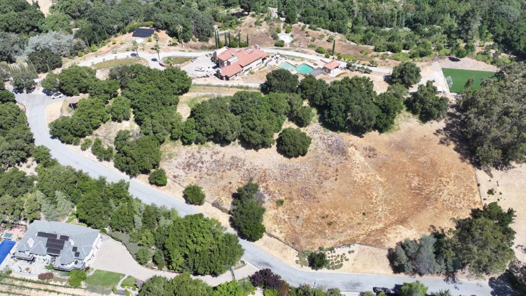 This stunning 2.67-acre parcel in Los Gatos, CA, offers an incredible opportunity to build your dream home amidst breathtaking views. Nestled in the hills, this prime land boasts panoramic vistas that stretch across the picturesque landscape, providing a serene and private setting. The expansive lot provides ample space for a custom-built residence, complete with luxurious amenities, outdoor living spaces, and even a pool if desired. With its desirable location, close proximity to downtown Los Gatos, and easy access to top-rated schools and amenities, this property is perfect for those seeking a tranquil yet convenient lifestyle. Dont miss the chance to create your perfect retreat in this coveted area of Silicon Valley.