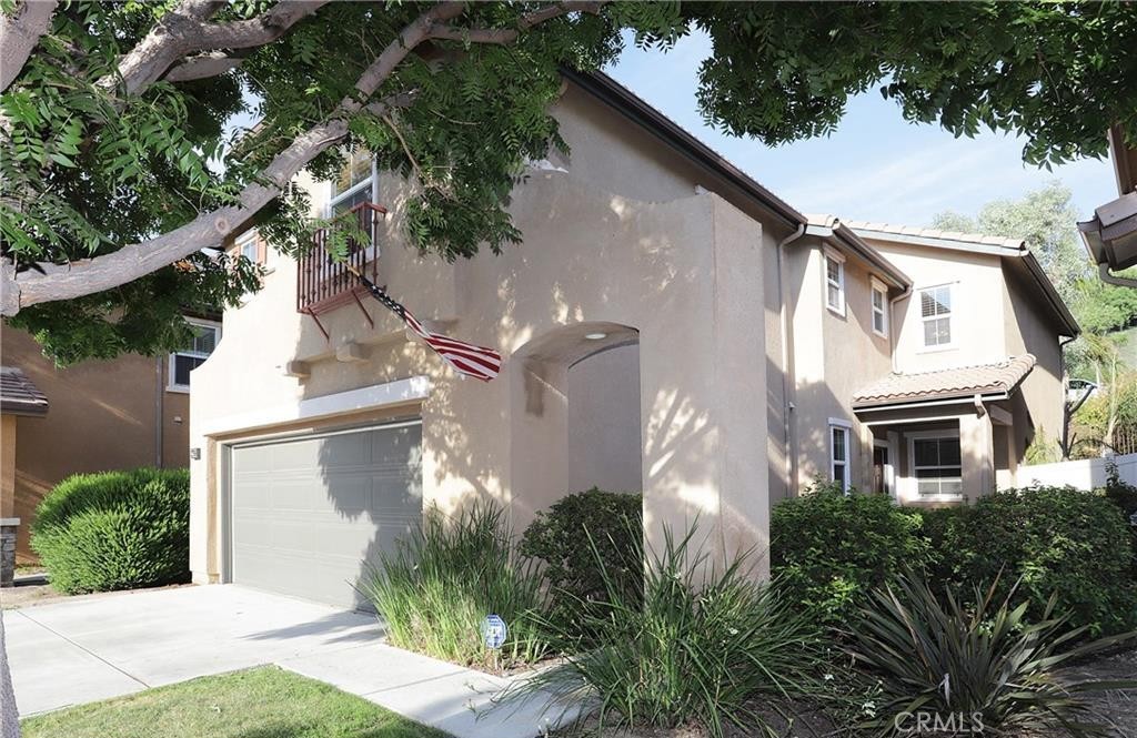 Perched in the hills of Canyon Country, this upgraded two-story home blends turnkey comfort with everyday convenience—minutes from quick 14 Freeway access and the best of the Santa Clarita Valley (parks and trails, dining, shopping, community events, and award-winning recreation).
Inside, high ceilings with crown molding and abundant natural light set a welcoming tone. Thoughtful improvements include a completely remodeled upstairs bathroom with contemporary trim, luxe fixtures, and a deep soaking tub; a refreshed downstairs restroom with a new vanity and fixtures; all new elongated toilets; and a new water heater. The flexible layout features a built-in office space with extra storage, walk-in closets, and in-home laundry hookups for easy living. The expansive primary suite provides a true retreat.
Outdoor spaces are dialed for low-maintenance living and privacy: premium turf in the backyard, privacy landscaping, and a full private balcony for morning coffee or what floats your boat! Front landscaping is handled by the HOA, so weekends stay free for fun. Additional highlights include durable epoxy flooring with a non-slip finish (classic palette), two-car garage plus full-size driveway, no shared walls, and a quiet cul-de-sac setting on recently resurfaced streets. Carpets are professionally cleaned yearly and the yard features a charming orange tree. The community is pet-friendly, with a low HOA, no Mello Roos and located in a cul-de-sac!
Enjoy turnkey comfort, effortless commuting, and the SCV lifestyle—all at 27656 Cordovan Dr.