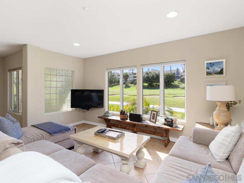 Experience upscale living with breathtaking panoramic golf course views from the primary suite, living room and private balcony in this beautiful 3 bedroom, 3.5 bathroom townhome. Combining elegance and comfort, this serene property is nestled within the prestigious Omni La Costa Resort and Spa Golf Course. Offering entry-level bedroom-bathroom, attached garage, washer dryer, and brand new A/C for year long comfort. Whether you're unwinding in peaceful surroundings or hosting guests in sophisticated style, this townhome delivers it all.