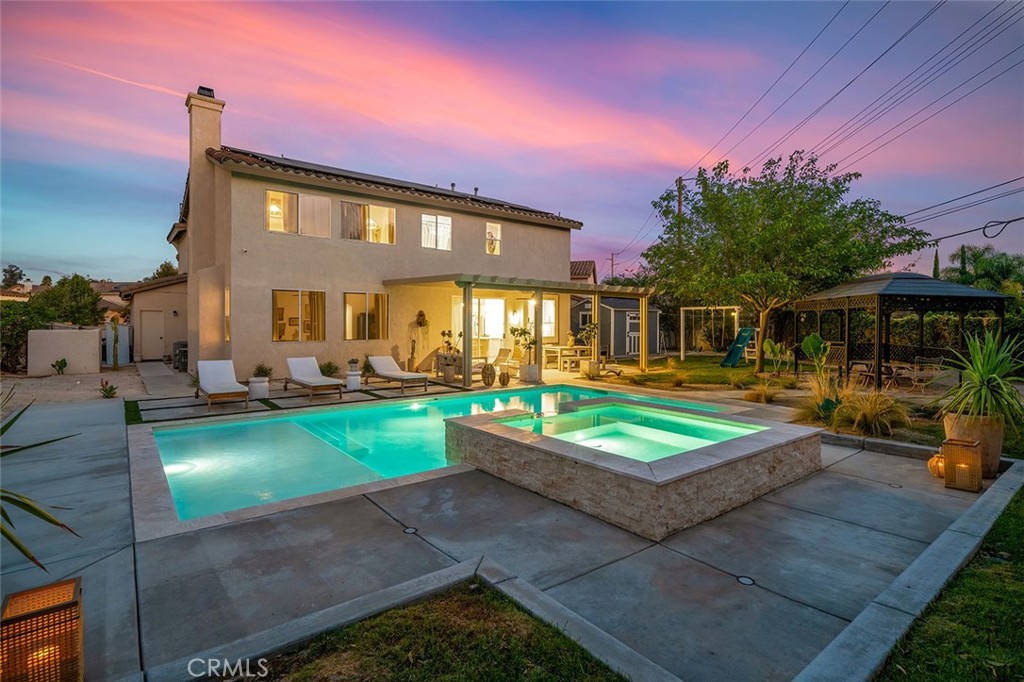 Highly upgraded pool home is priced to sell! This stunning home has been thoroughly updated inside and out and features a massive backyard with a brand-new sparkling pool and spa! And inside the home is pure eye candy, boasting new Quartz countertops throughout, luxury vinyl plank flooring, stainless steel appliances, sink fixtures, hardware, custom lighting, newer windows, paint, A/C unit, whole house fan, and more! The modernized kitchen hits all the marks, with farm sink, gorgeous warm hue Quartz countertops, and designer touches such as the chevron backsplash and soft-
bronze finished hardware. From there, the kitchen connects seamlessly to the breakfast area and family room with wood-burning fireplace, creating a cozy, but open main living space. Across the hall is an updated bathroom, a bedroom, a larger formal dining area, and a light-filled, open living room, all illuminated by custom, updated light fixtures that add to the ambiance throughout. Head up the impressive staircase to a spacious loft/bonus room, perfect for a kids’ playroom, media room, or easily converted fifth bedroom. The primary bedroom offers extra flex-space and built-in storage, suitable for a home office, gym, or media room. The primary bathroom features a large soaking tub, a separate shower, and a large walk-in closet. There are two more bedrooms and a bathroom upstairs, all tastefully updated. The backyard is a dream come true where you’ll get to enjoy the SoCal sun in your new pool and spa with top-of-the-line ozone filtering, a large Alumawood-covered patio for lounging and dining under the shade, a large and super useful Tuff Shed, custom outdoor lighting, water-efficient landscaping, and, to top it off, no rear neighbors, culminating in the perfect outdoor living space! The oversized three-car garage includes built-in storage, epoxy-coated floors, and a soft-water system. Come live your best life and enjoy low taxes and no HOA, just a short drive to Historic Old Town Murrieta, top schools like Cole Canyon Elementary, excellent restaurants, hospitals, and shopping. All of this is set against the natural backdrop of the Murrieta foothills and Santa Rosa Plateau Ecological Reserve, while conveniently located near the 15 Freeway and the famous Temecula Wine Country.