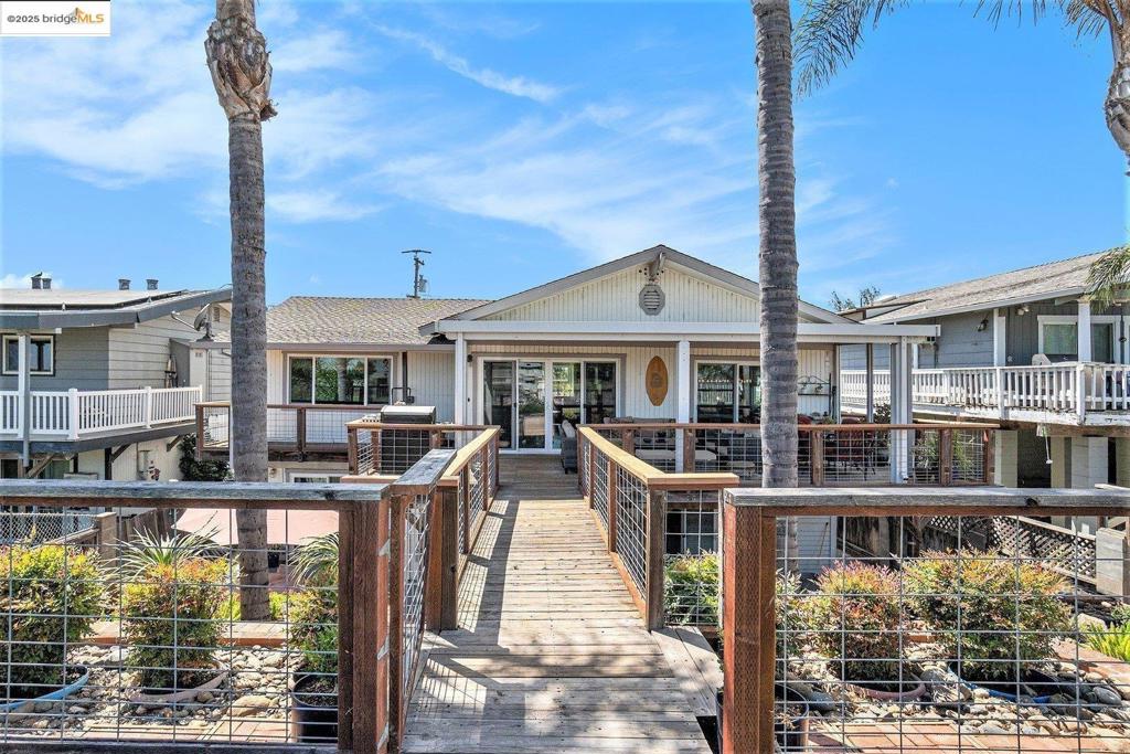 DELTA WATERFRONT RETREAT!!! Live the Delta lifestyle in this beautifully updated home featuring private dock, ideal for boating, paddleboarding, jet skiing, fishing or simply enjoying the view. The interior boasts a remodeled kitchen with top-of-the-line appliances, custom cabinetry and premium finishes. All bathrooms have been renovated, offering modern style and comfort throughout. New waterproof flooring adds durability and elegance, perfect for waterfront living. The retaining walls has been replaced along with beautiful banisters around the deck. Wow! There's a Community water well making water only $350/year. Move-in ready for full-time living or weekend getaways...SELLER IS OFFERING A CONCESSION TOWARDS BUYER'S CLOSING COSTS!!!