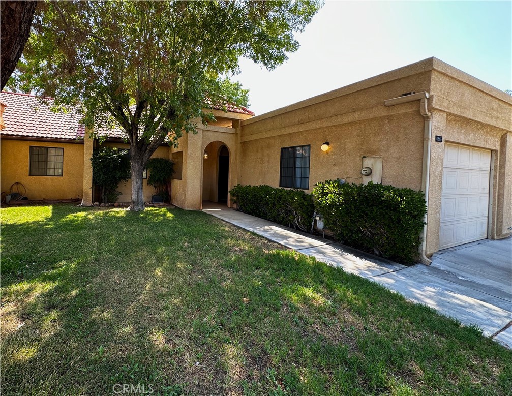 Welcome to this charming two bedroom, two bath home located in the desirable Jess Ranch 55+ community. With a square footage of 990 ft.², this move-in ready home offers a comfortable and spacious living space. Step into the open floor plan of this lovely home, featuring a well-designed layout that maximizes both function and style. The abundance of natural light creates a warm and inviting atmosphere. The mature landscaping in the gated backyard provide a peaceful and private area, perfect for relaxing or entertaining guests. Enjoy the serene ambiance and tranquility that the surrounding area offers. This home boasts two sliding glass doors leading into the backyard, allowing for seamless indoor-outdoor living. Embrace the California lifestyle and enjoy the convenience of easy access to your outdoor oasis. The nice laminate wood flooring throughout the main living areas adds a touch of elegance, while the plush carpet in the bedrooms provides comfort and coziness. Experience the perfect blend of style and comfort in every room. With a one car garage, you'll have ample space for parking and storage. Take advantage of the convenience and security that a garage provides. Don't miss out on the opportunity to own this beautiful home in the sought-after Jess Ranch 55+ community. Schedule a viewing today and make this your dream home! All information deemed reliable, but not verified. Buyer is advised to satisfy themselves by rights of investigation and verification.